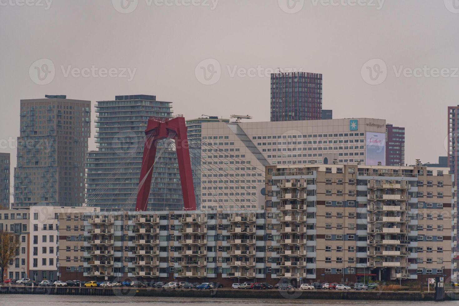 housea at a bridge in rotterdam photo