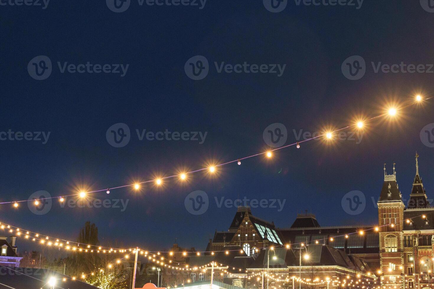 many lights in the city of Amsterdam at night in holland photo