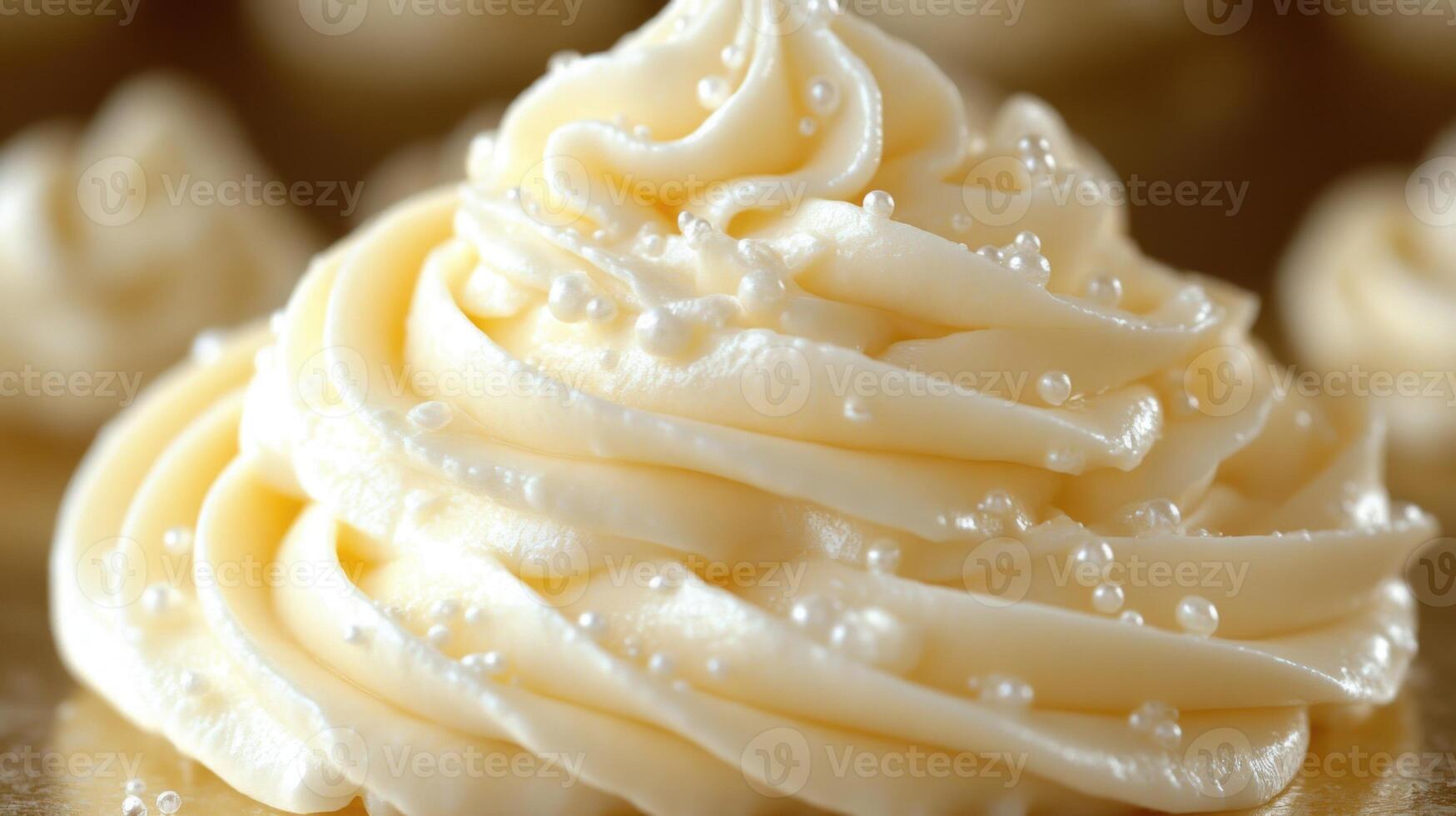 Delicate frosting swirls enhance an elegant dessert display with sparkling sugar pearls photo