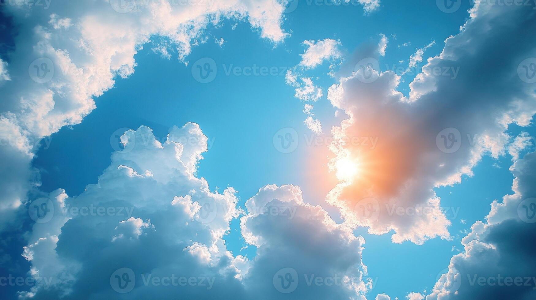 Soft clouds float in a blue sky as the sun shines brightly, creating a tranquil morning vibe photo