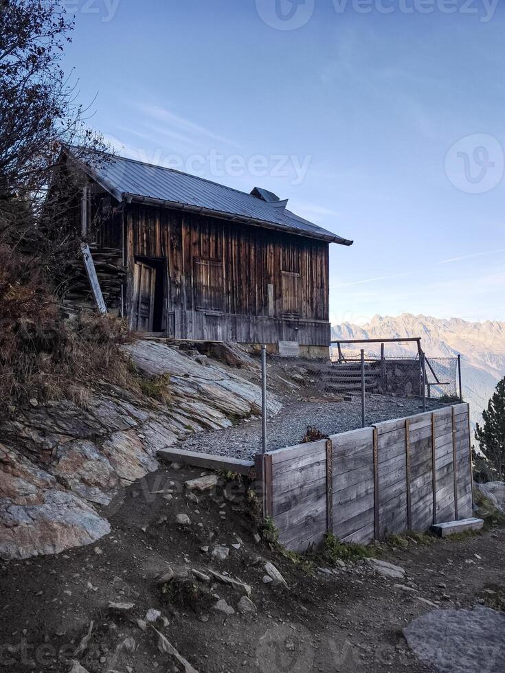 Old wooden chalet overlooking chamonix valley in autumn photo