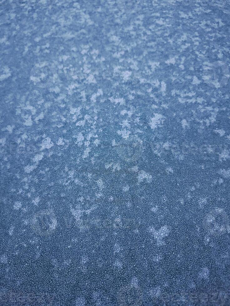 Frozen surface showing intricate ice crystals in chamonix, france photo