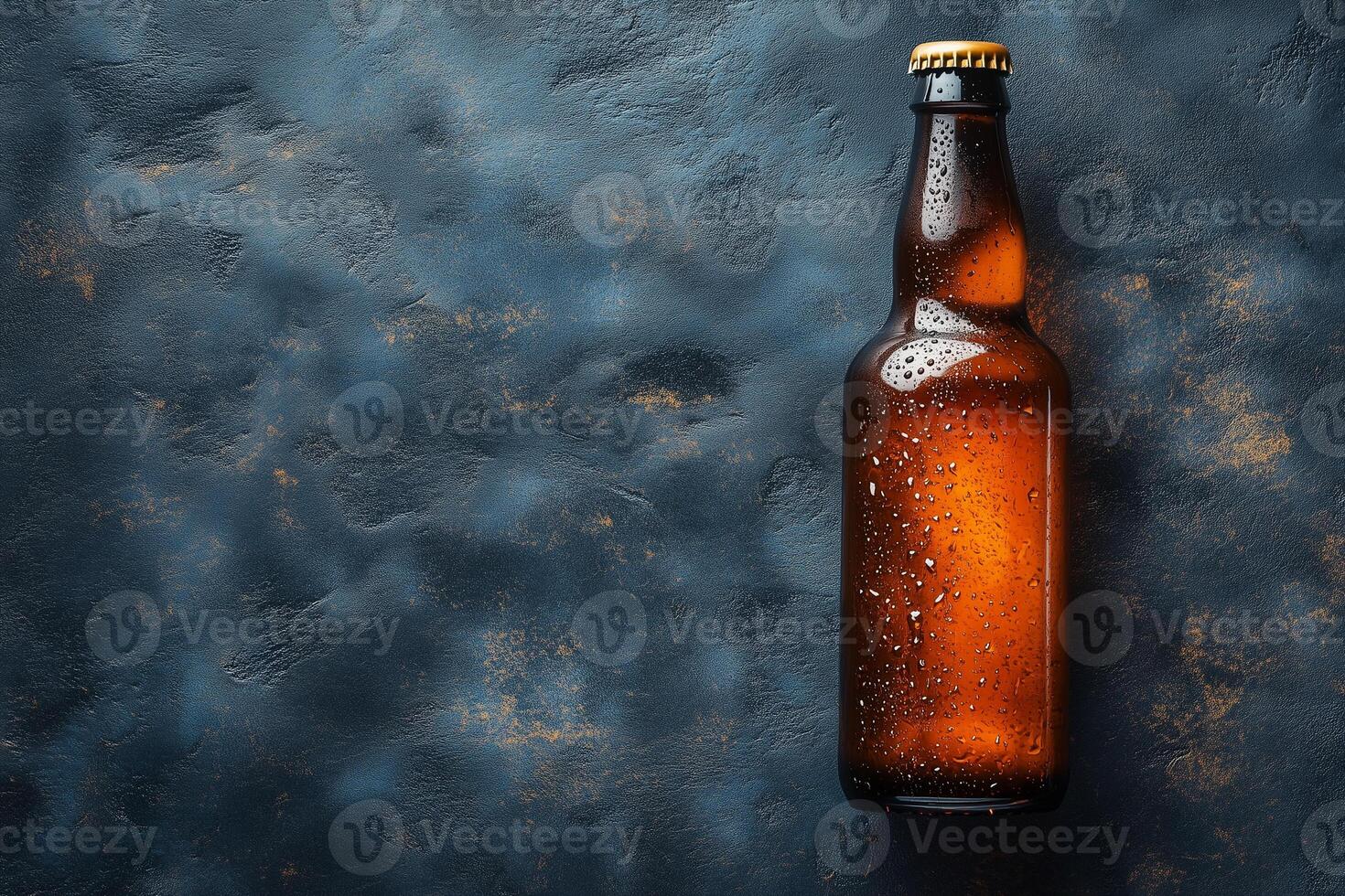Wet glass beer bottle on a dark textured background with copy space. Copy space photo