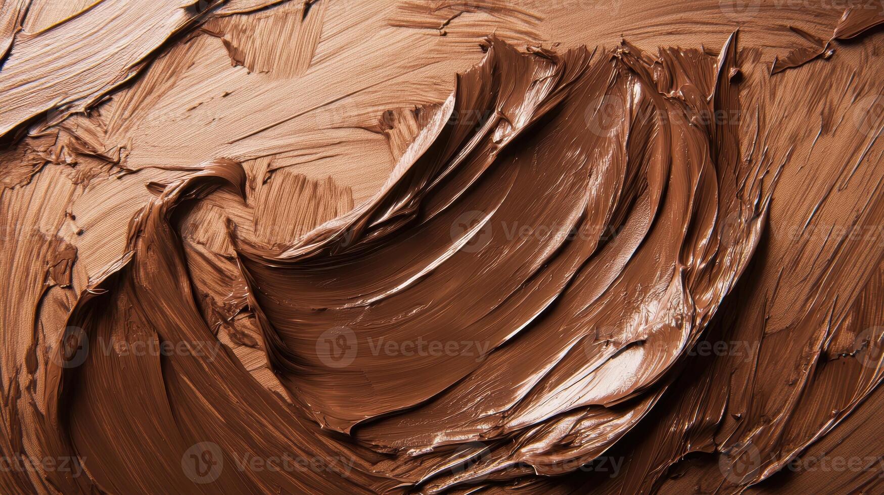 Rich swirl of smooth chocolate spread with textured surface patterns. photo