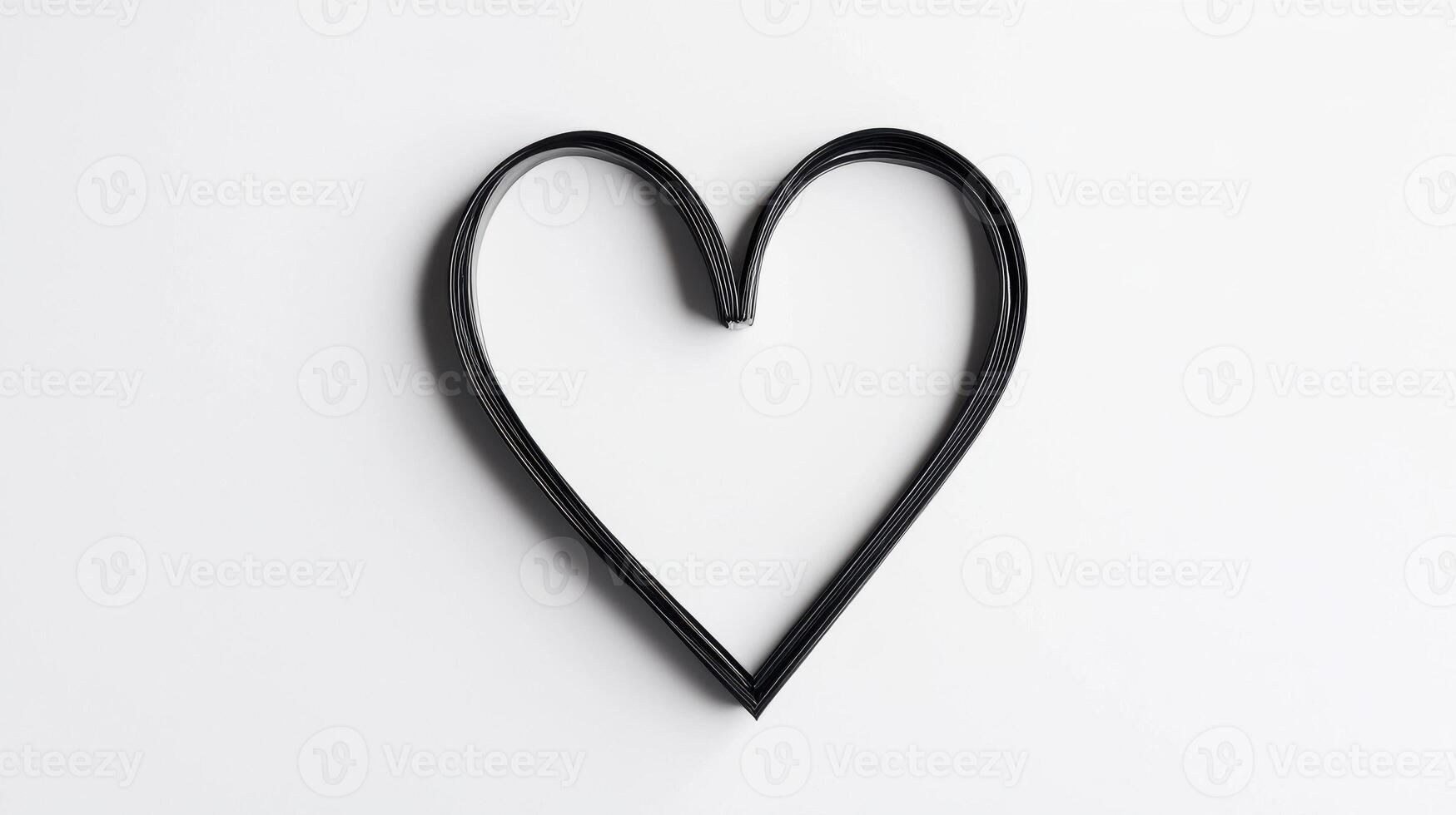 Minimalistic heart shape made from black wire on white background photo