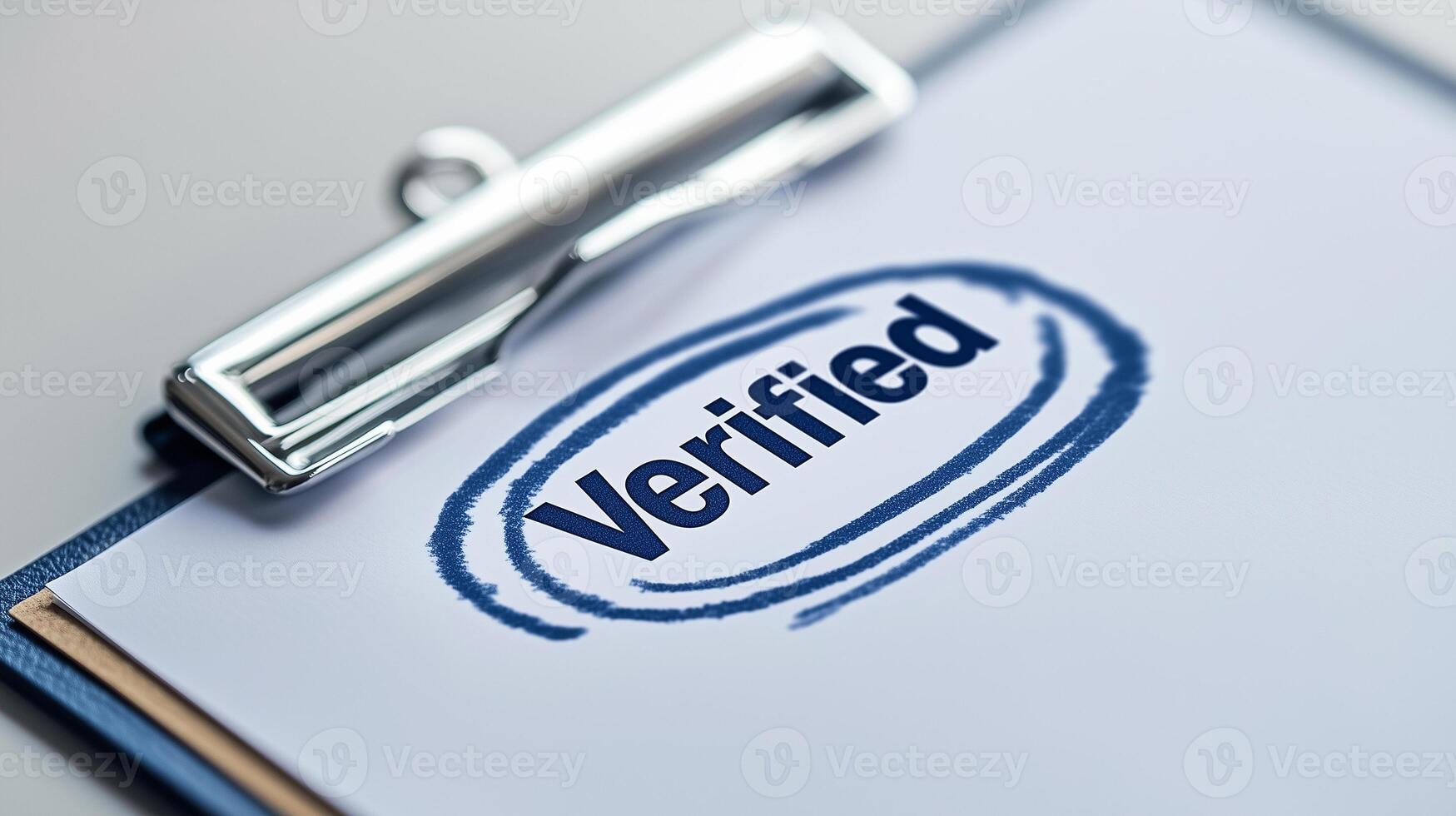 clipboard with a sheet marked with a Verified stamp photo