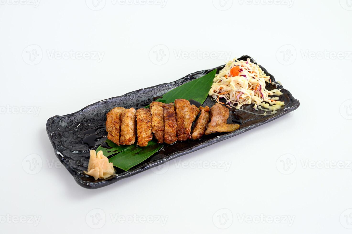 Chicken steak with teriyaki sauce and cabbage salad photo