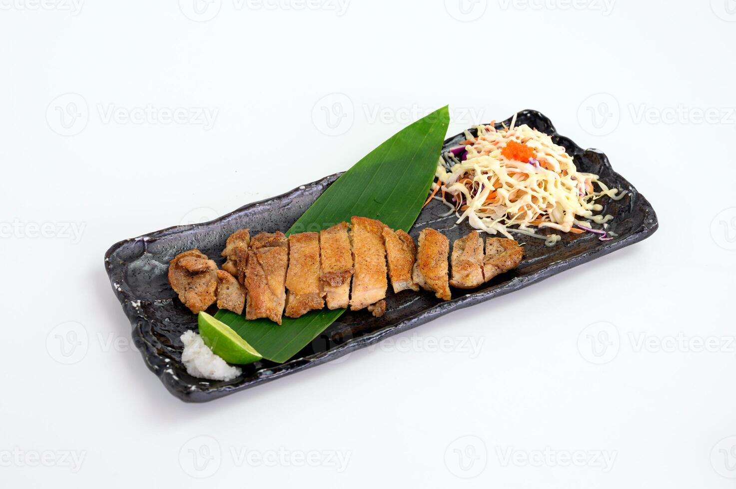 Chicken steak with salt and lime seasoning and cabbage salad photo