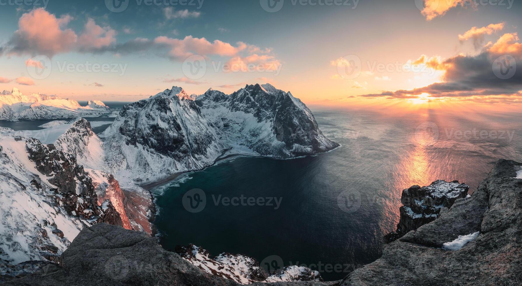 Panorama of Sunset over Ryten mountain and Kvalvika beach in winter at Lofoten Islands photo