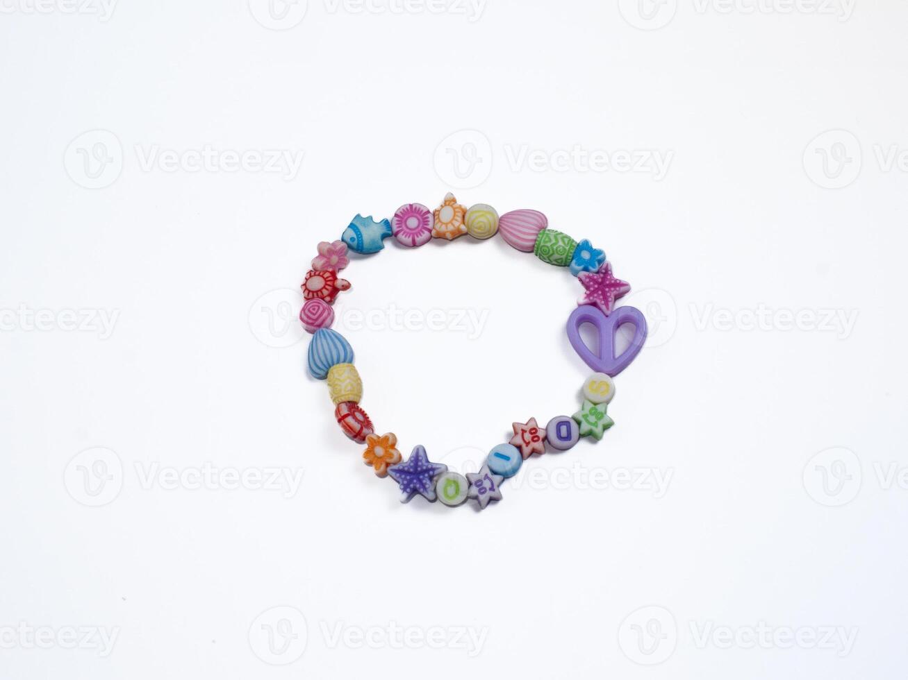 A vibrant bracelet made of assorted beads featuring a heart charm, ideal for casual wear or gifting. photo