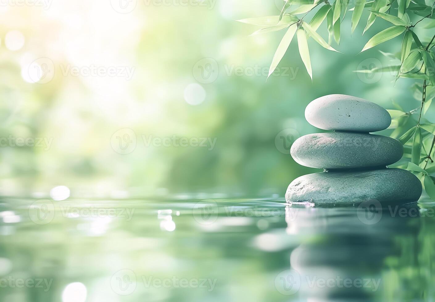 Beautiful green nature background for spa accented by solar lighting, with balanced stones and bamboo photo
