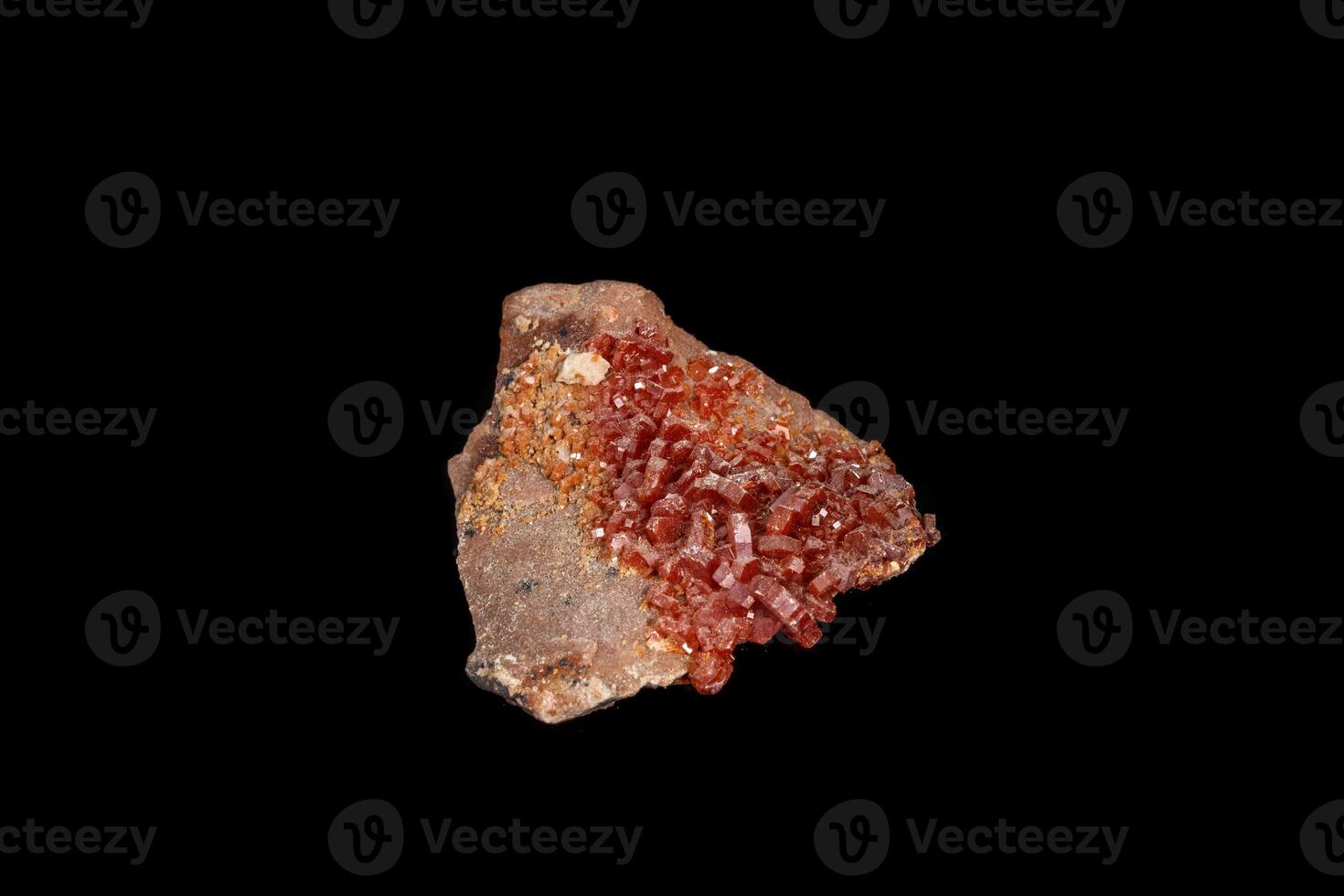Macro mineral stone Vanadinite on a black background close up photo