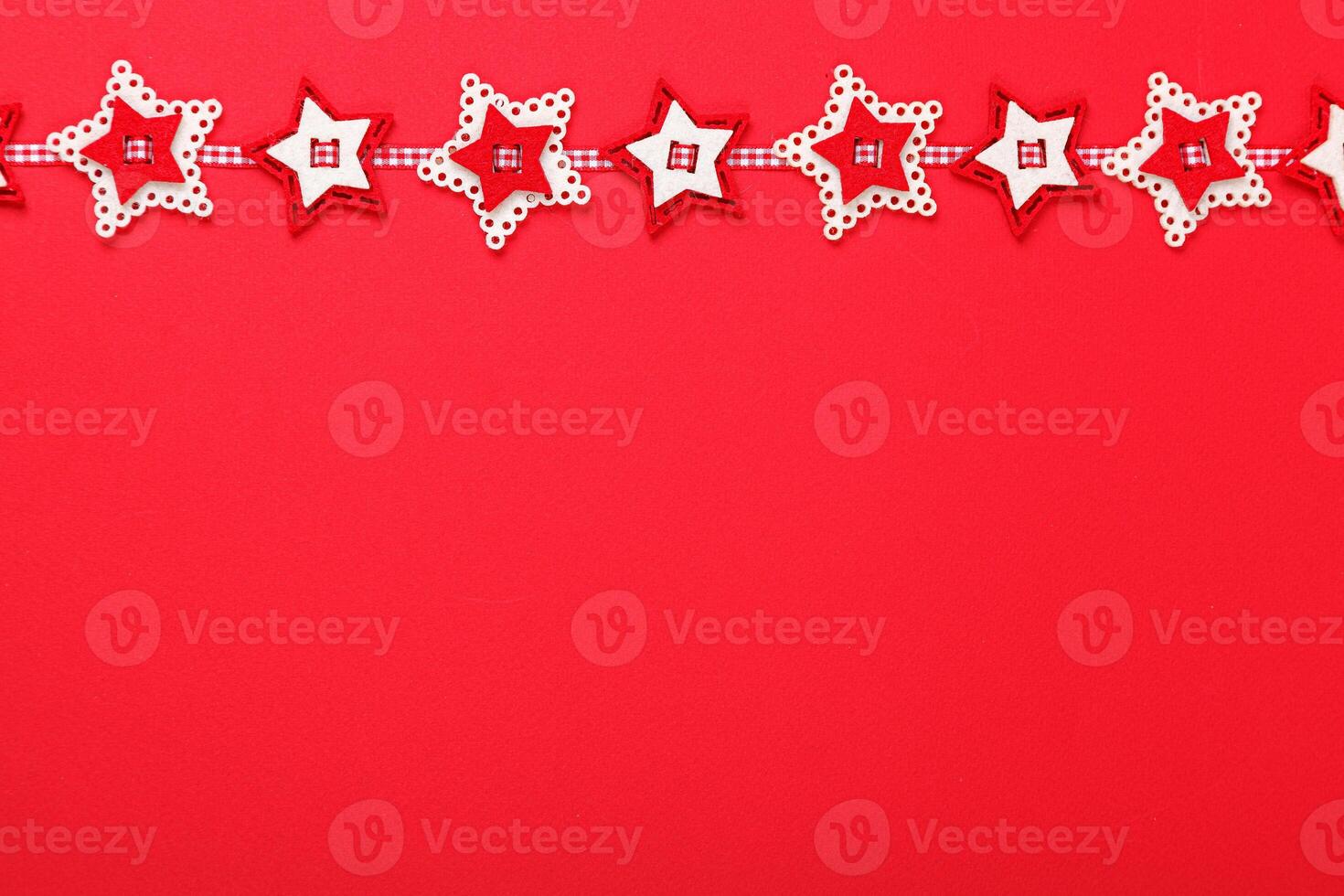 close up Christmas garland on a red background photo