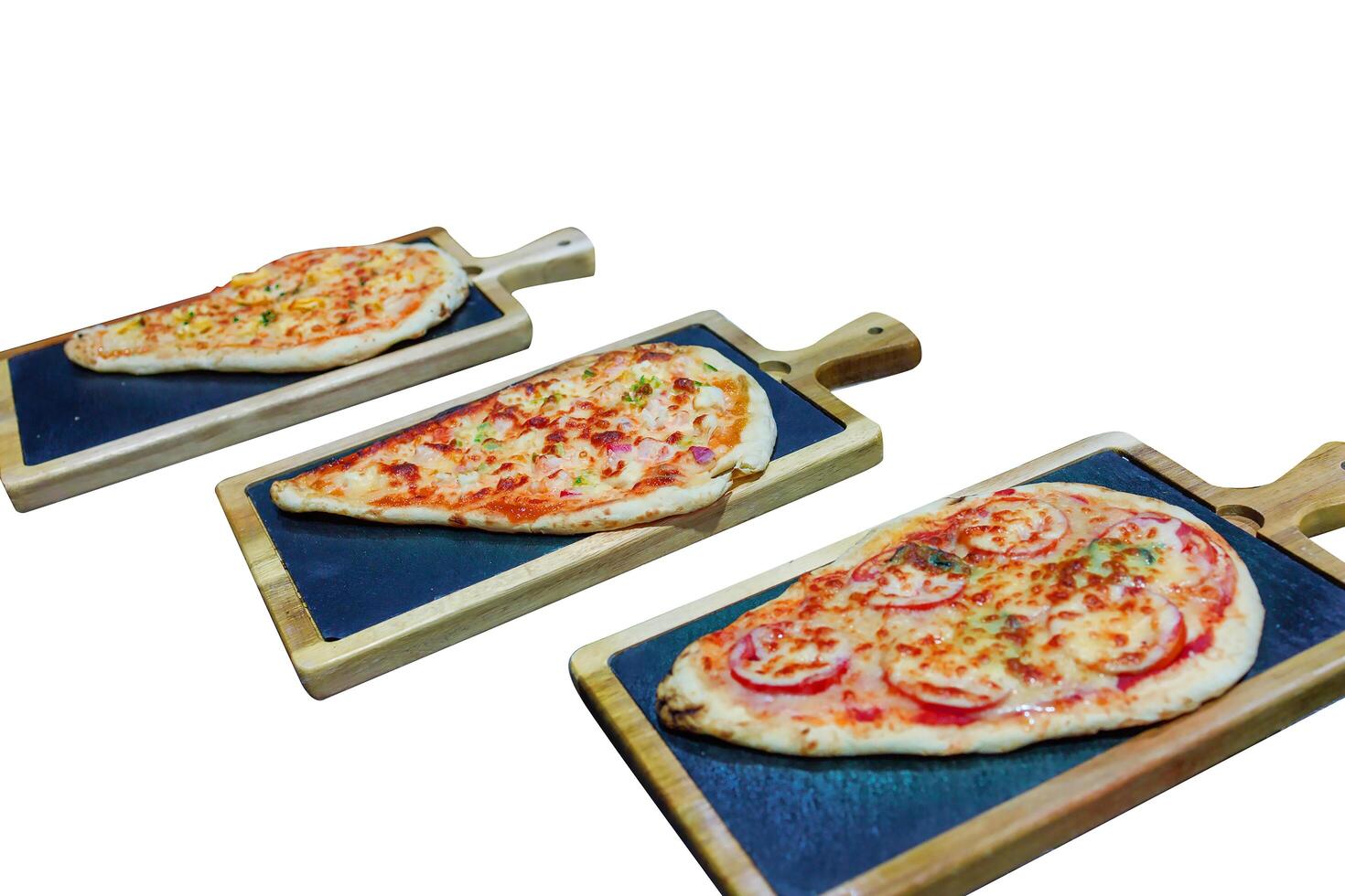 Top view of Italian Pizza with fresh tomato, olives and basil on an old wooden, focus selective photo