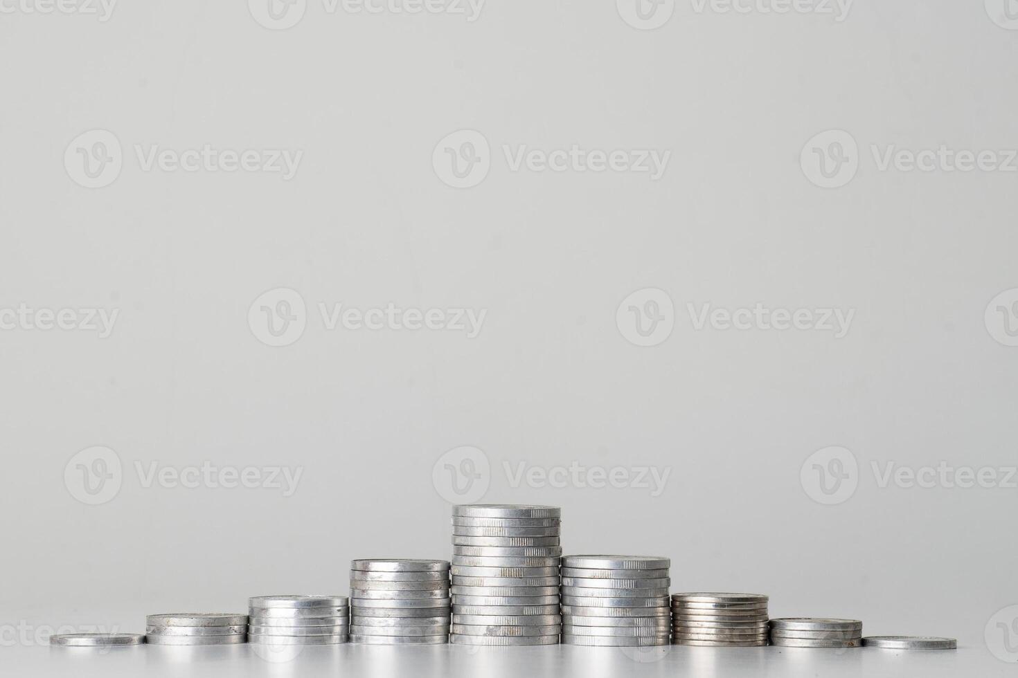 coins stacked symmetrically on the table photo