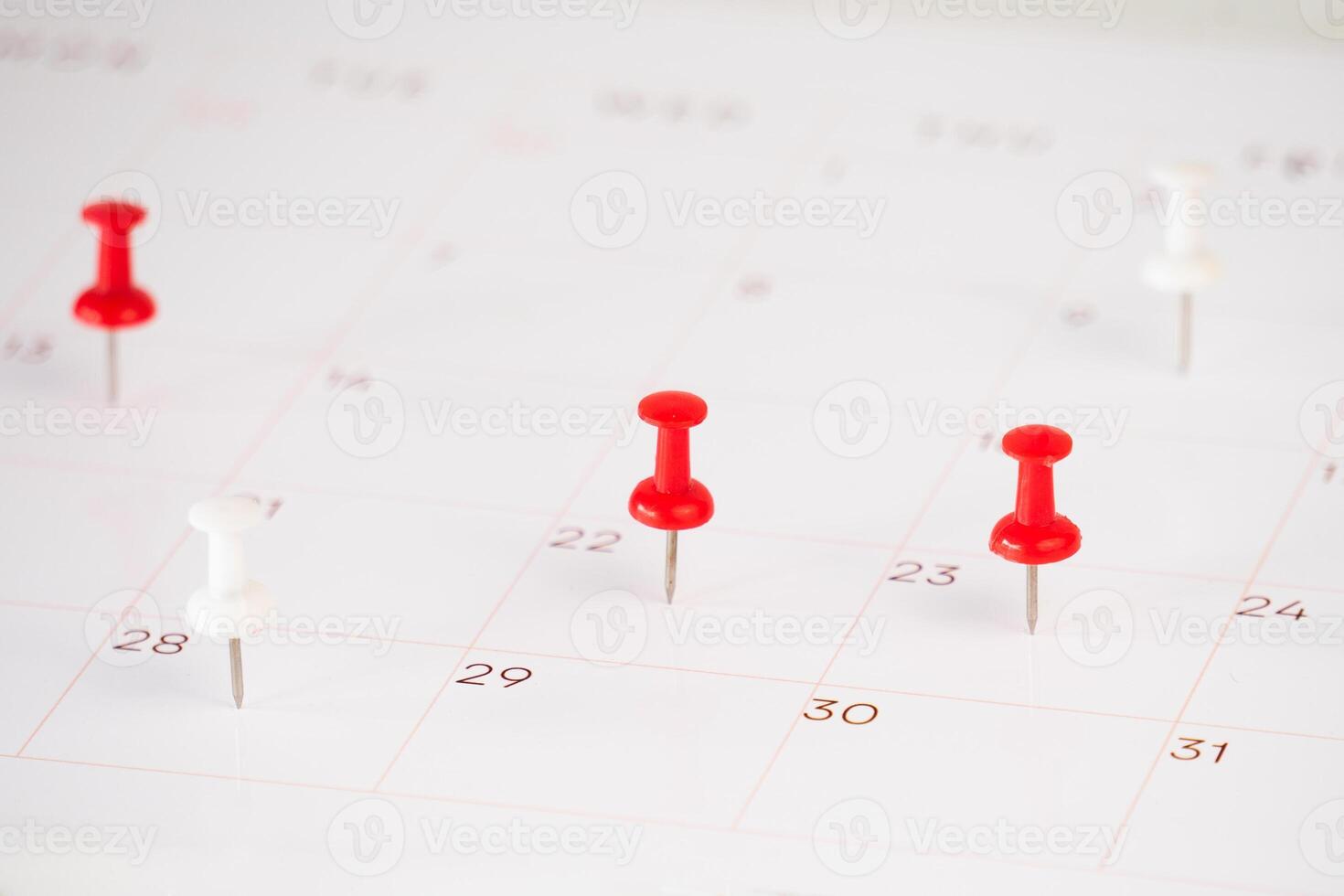 background of calendar and push pin stack on it photo