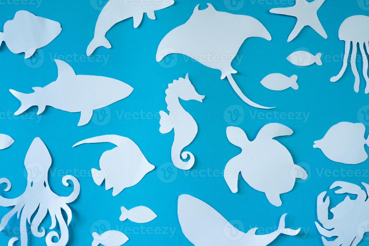 Fish pattern background in paper cut out craft photo
