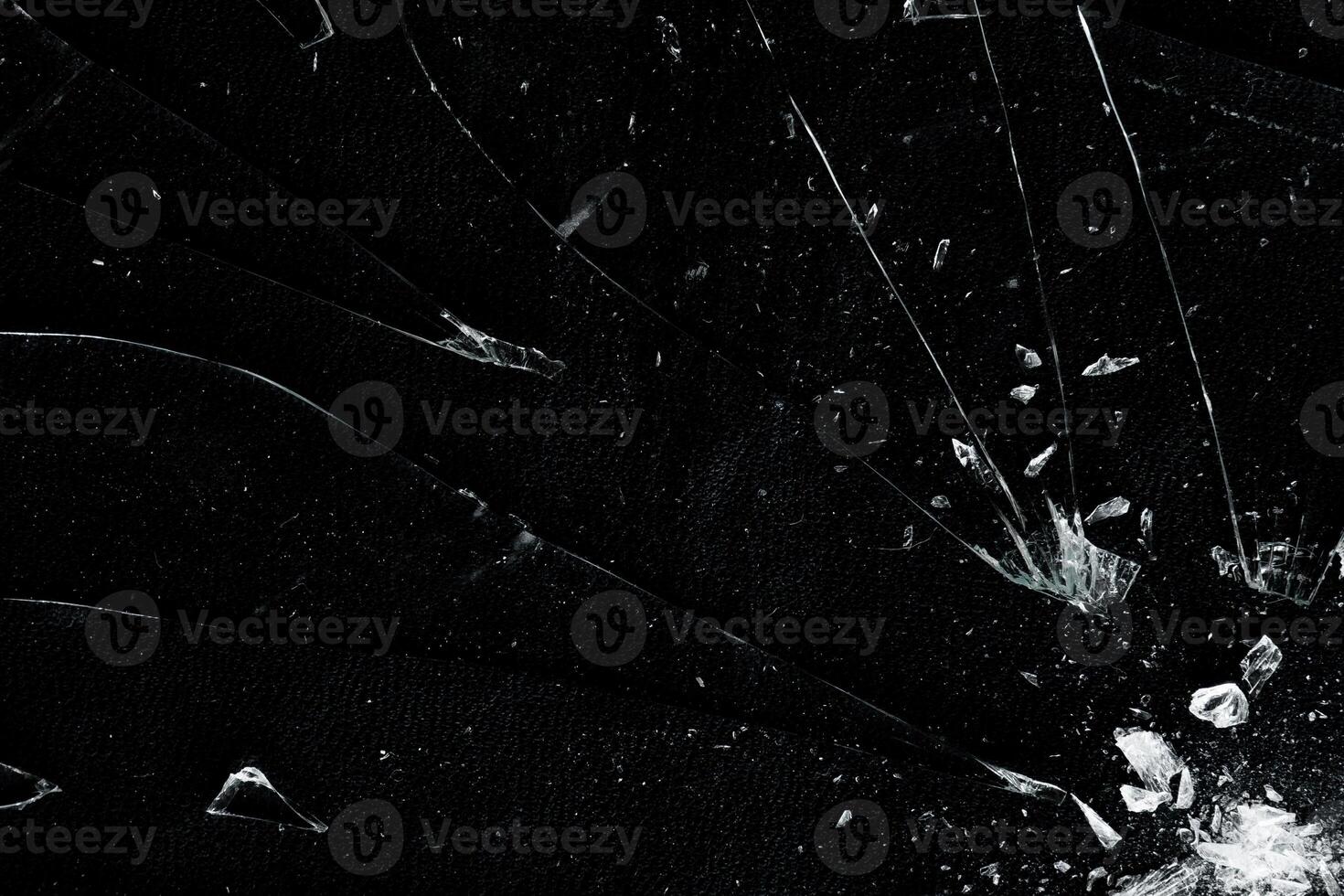Broken hit glass with crack and particle overlay photo