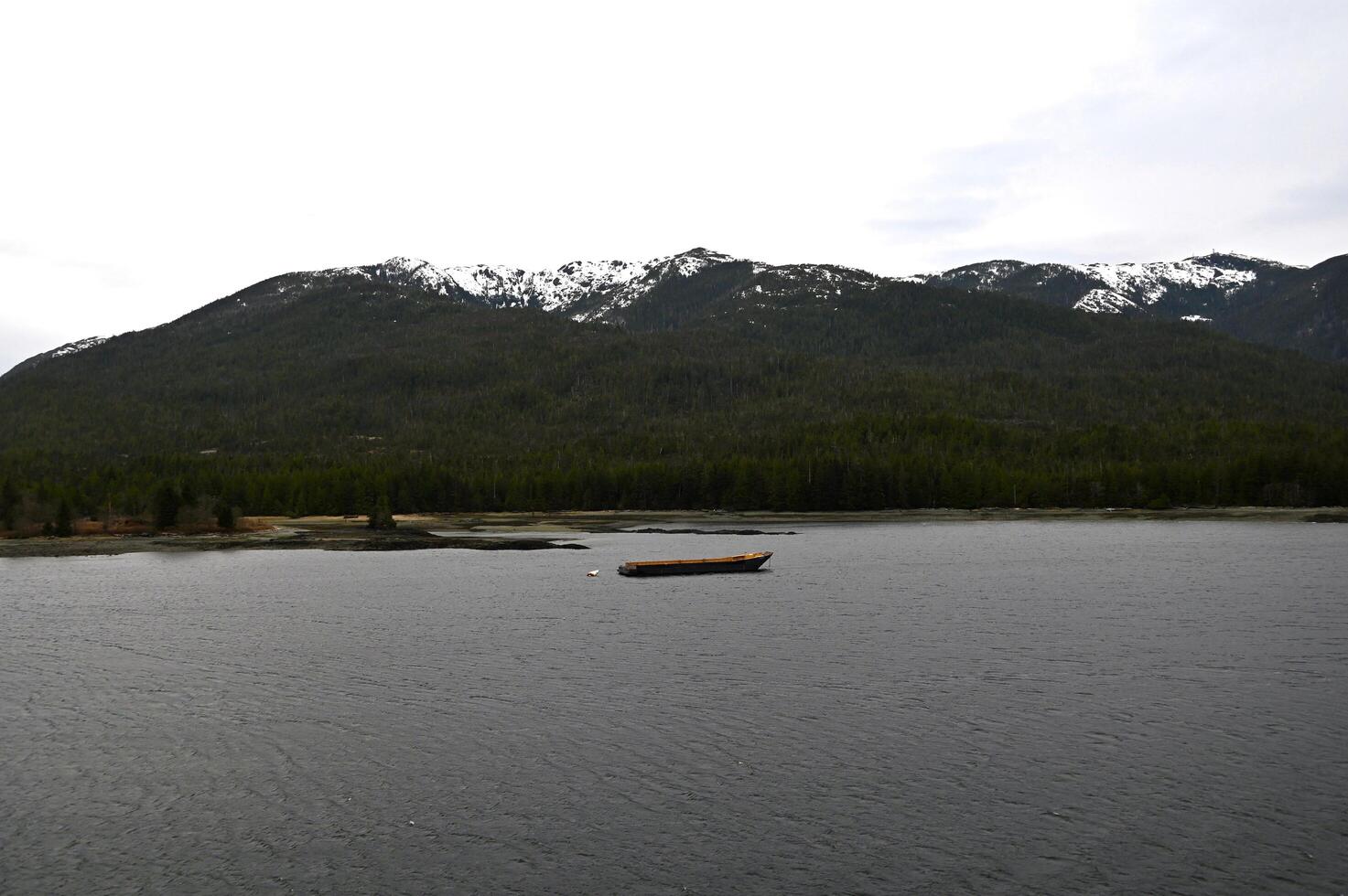 An empty barge in the lonely waters of Alaska photo