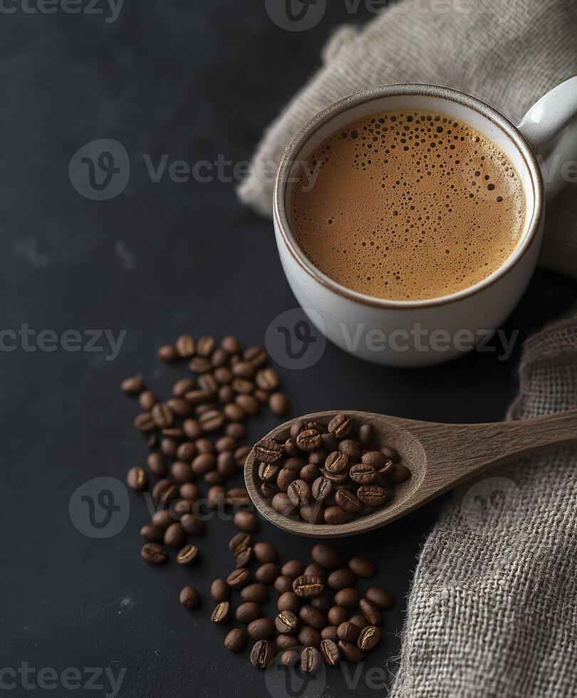 A cup of coffee and some brown coffee beans in the background photo