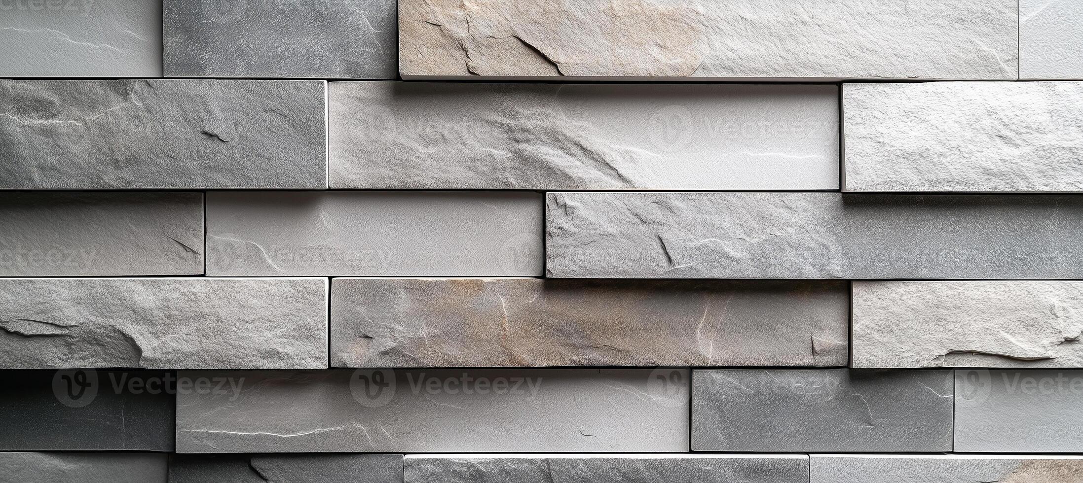Light gray brick wall cladding with rectangular tiles photo