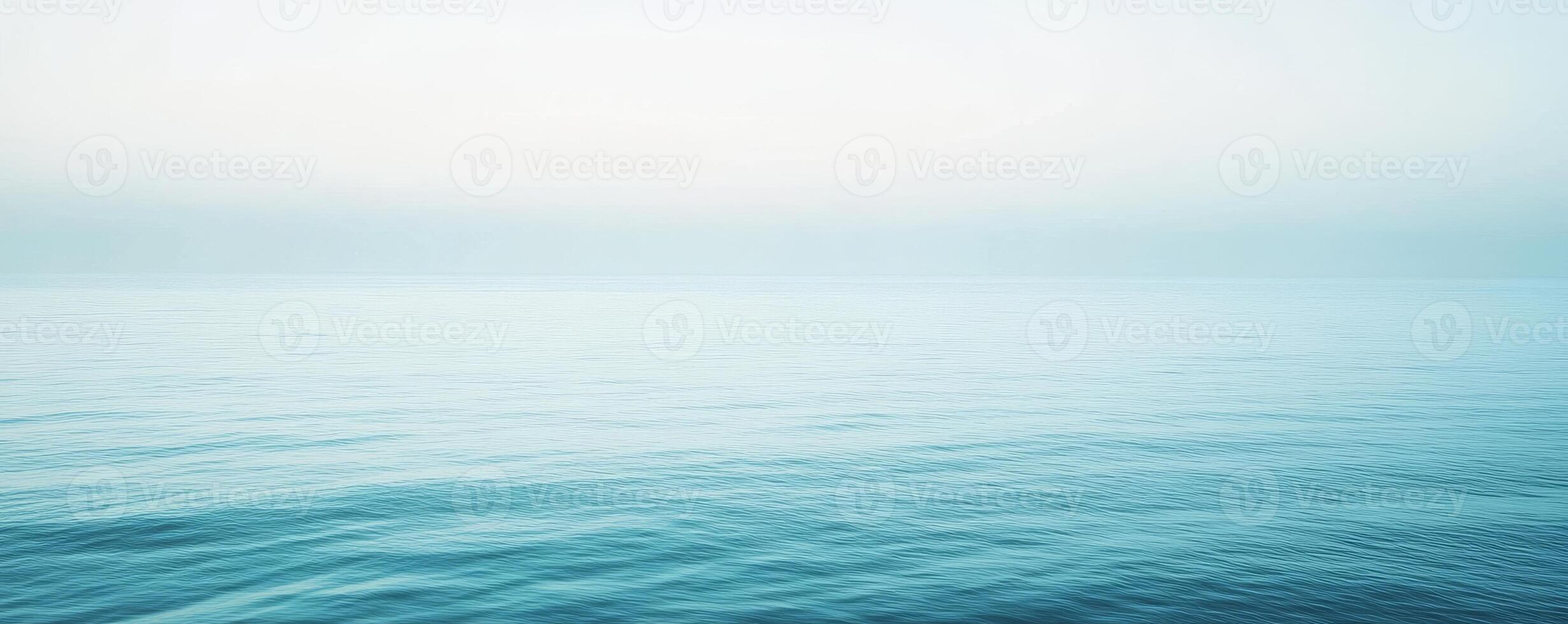 Calm ocean horizon with gentle waves under clear sky photo