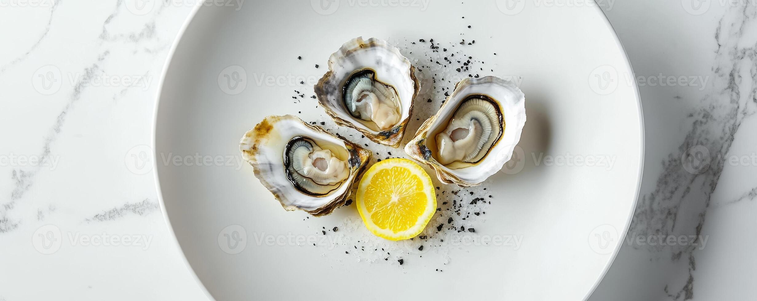 plate with fresh oysters and lemon on marble table, gourmet seafood dining concept photo