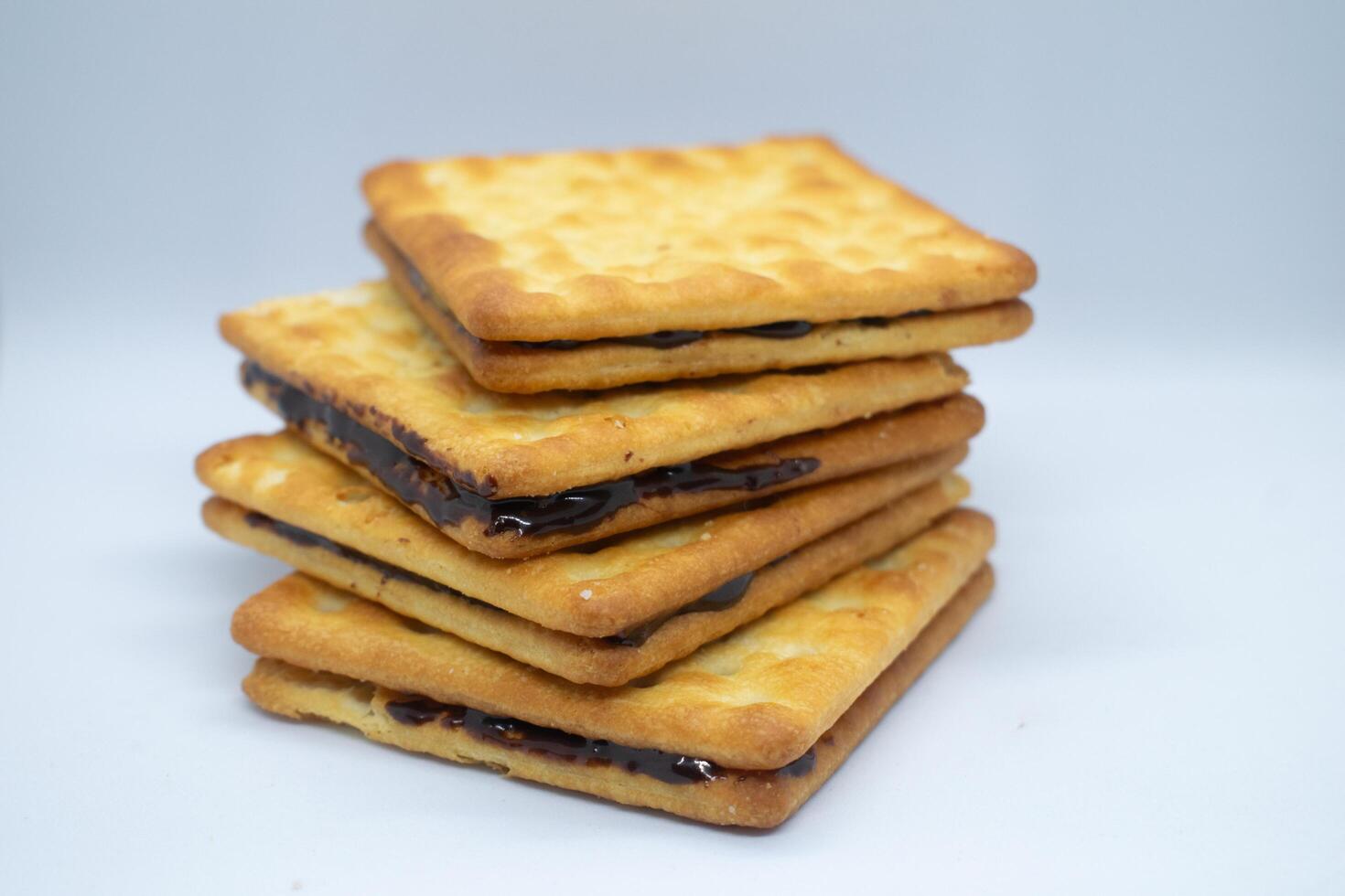 Stack of sweet biscuits isolated on white background. Perfect for recipes, catalogs, design elements, product packaging or any commercial purposes. photo