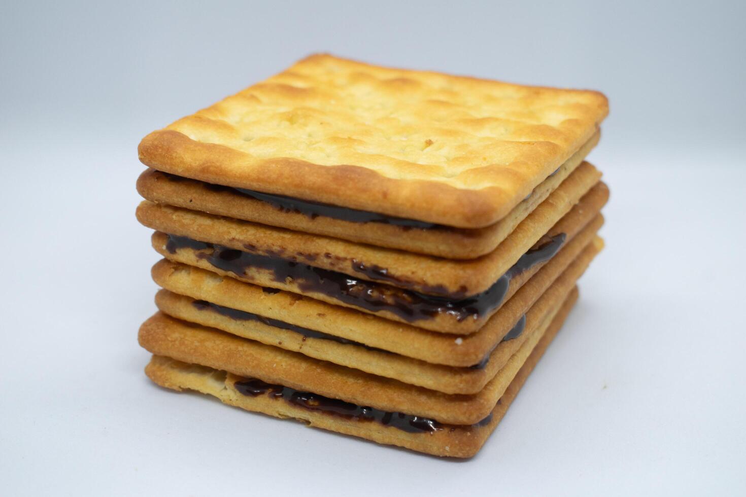 Stacked biscuits isolated on white photo