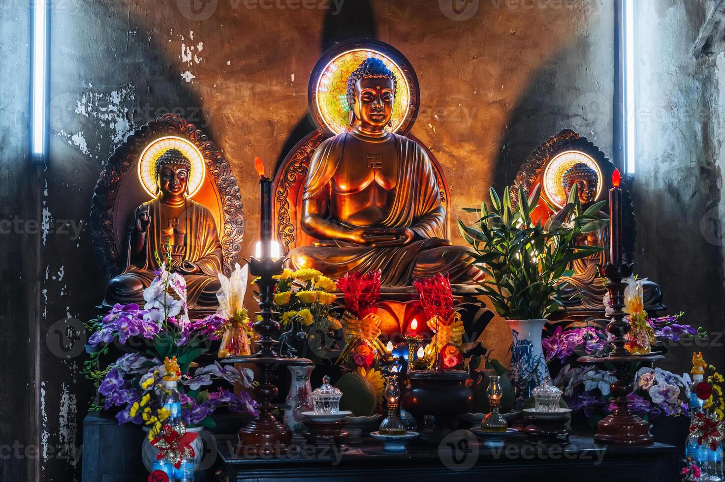 Buddha statues inside temple at Buddhist Pagoda in Nha Trang in Vietnam in Asia photo