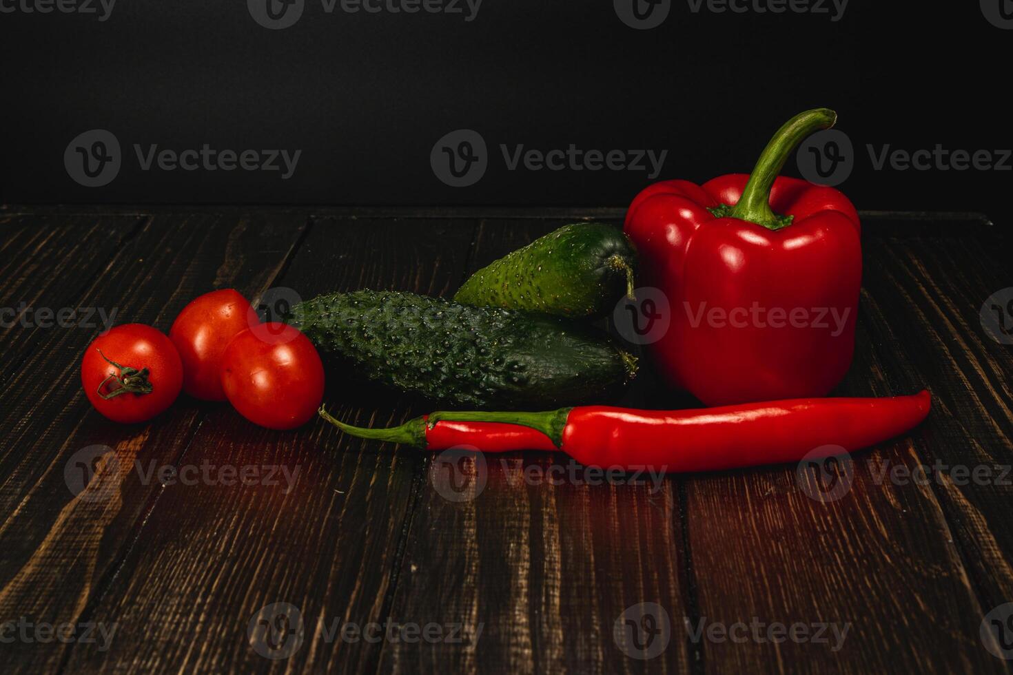 Fresh and vibrant vegetables arranged artistically on a wooden surface photo