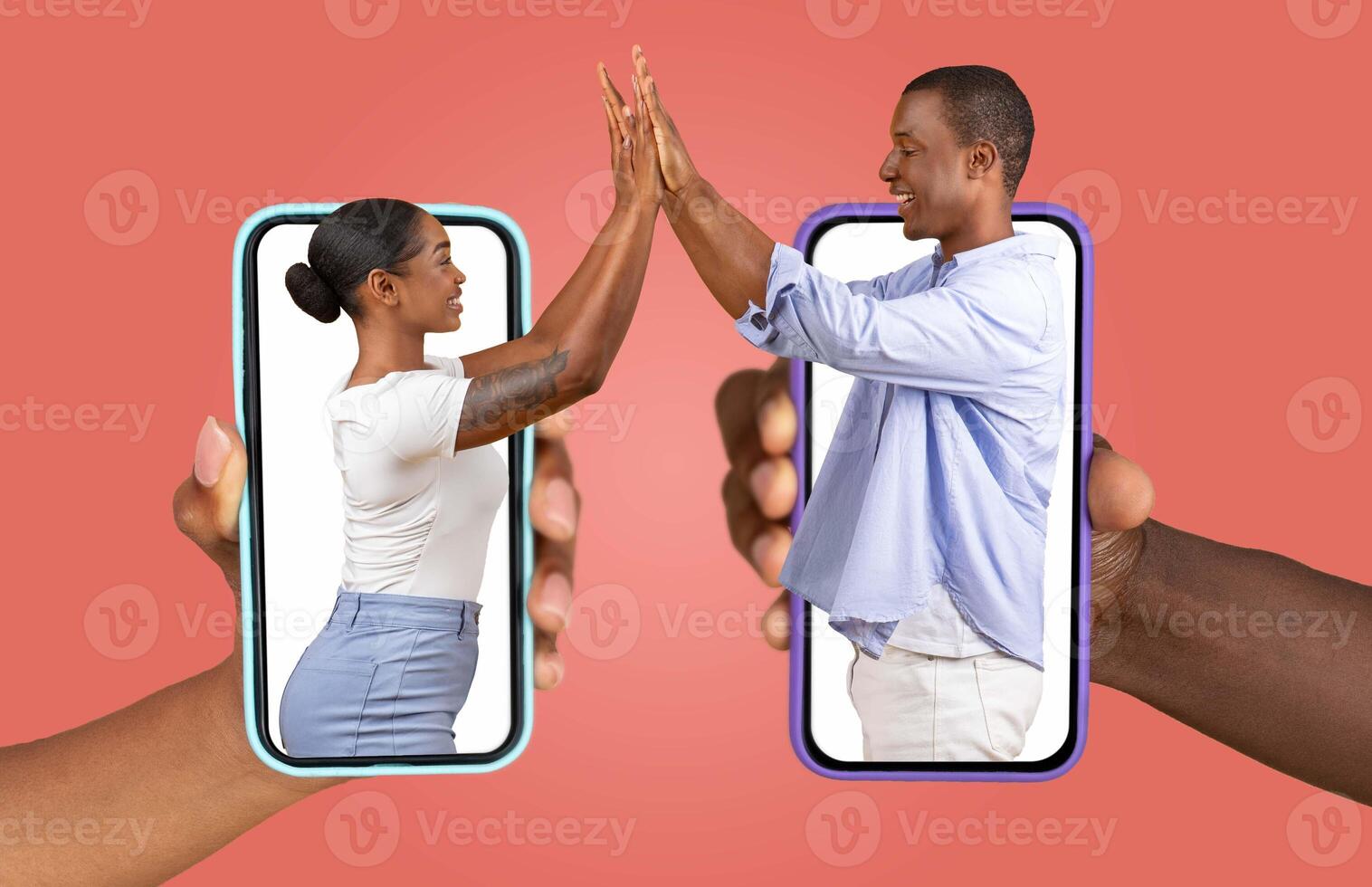 African American couple is connecting through their smartphones, showcasing their love and affection. They appear engaged in a joyful exchange, representing a modern relationship in the digital age. photo
