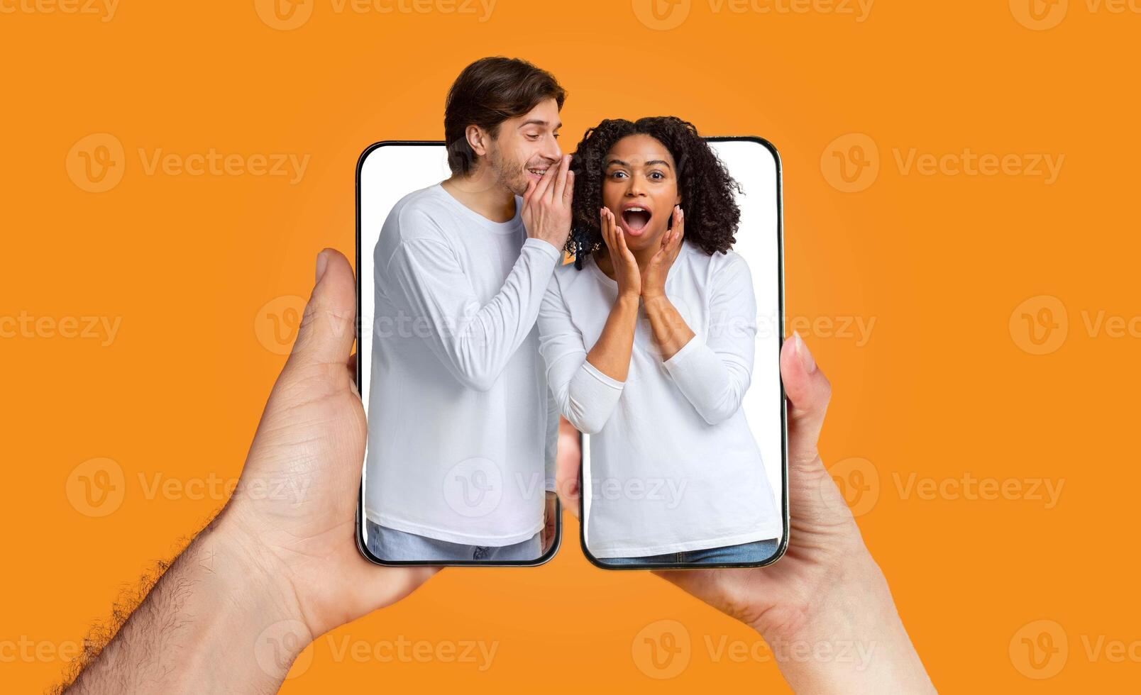 A man and woman share an excited conversation while holding a smartphone. Their expressions show joy and surprise as they connect through technology. This captures modern relationship dynamics. photo