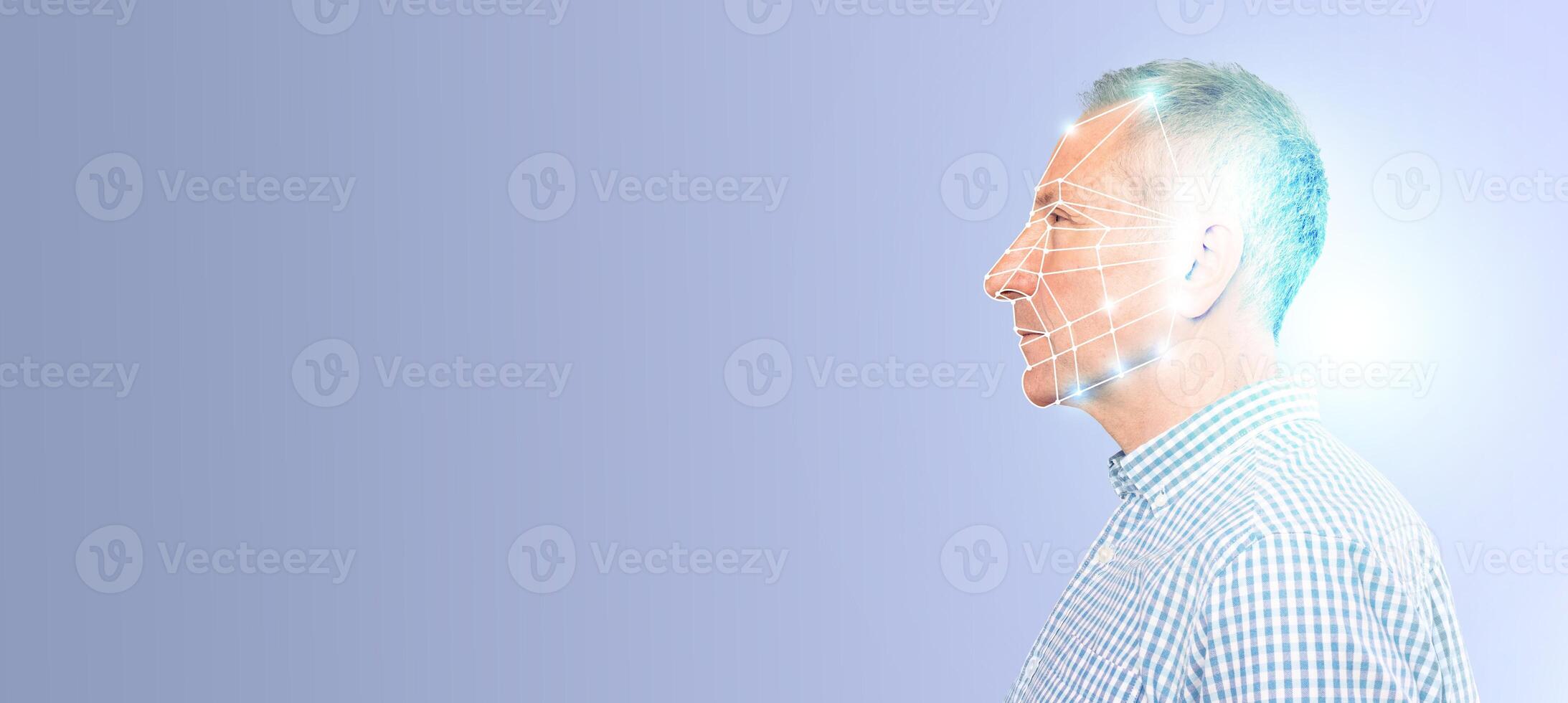 A man is highlighted with digital facial recognition grids, showcasing modern identification technology used for security and verification. photo