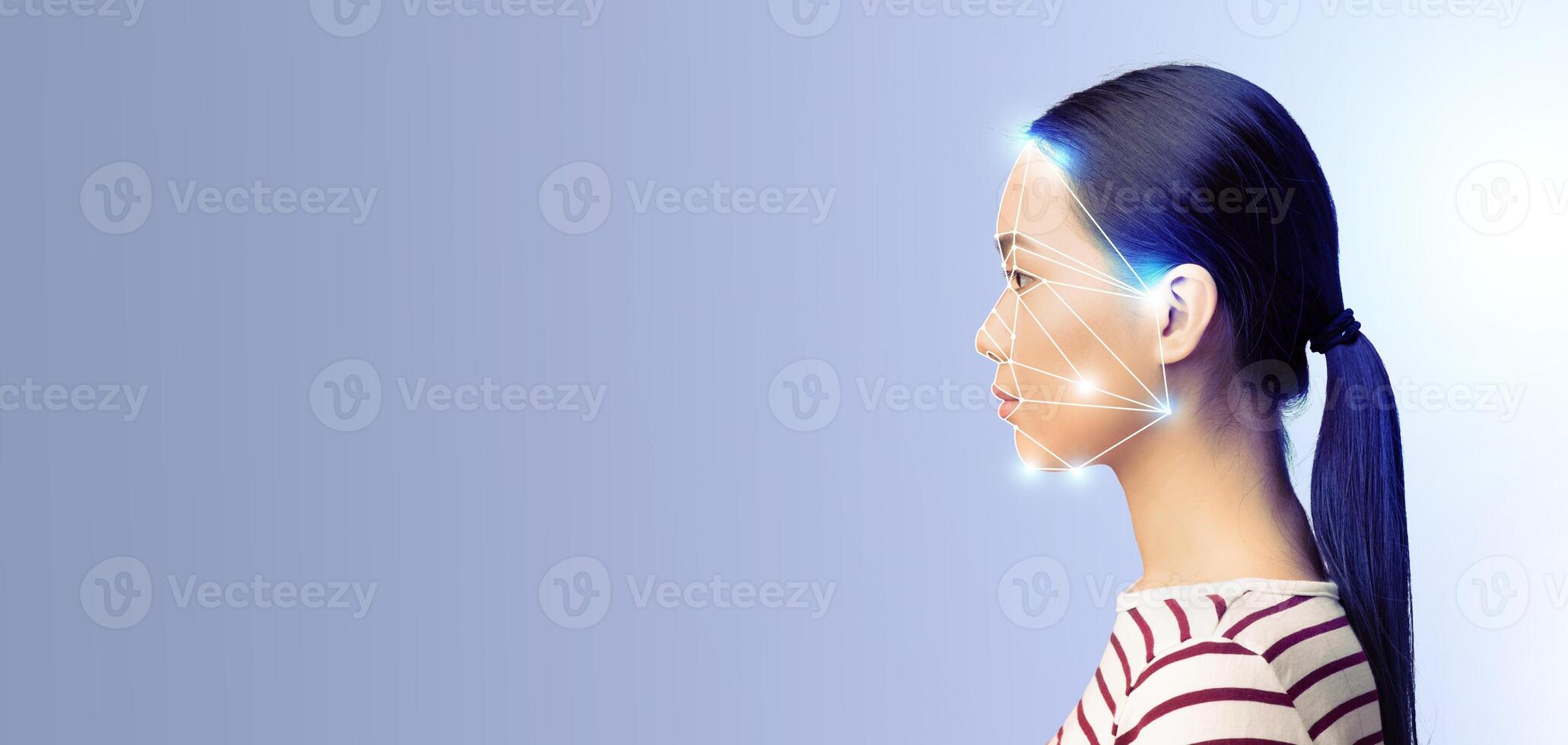A person is positioned in profile against a plain background, showcasing a digital overlay indicating facial recognition technology. This highlights advancements in identification methods. photo