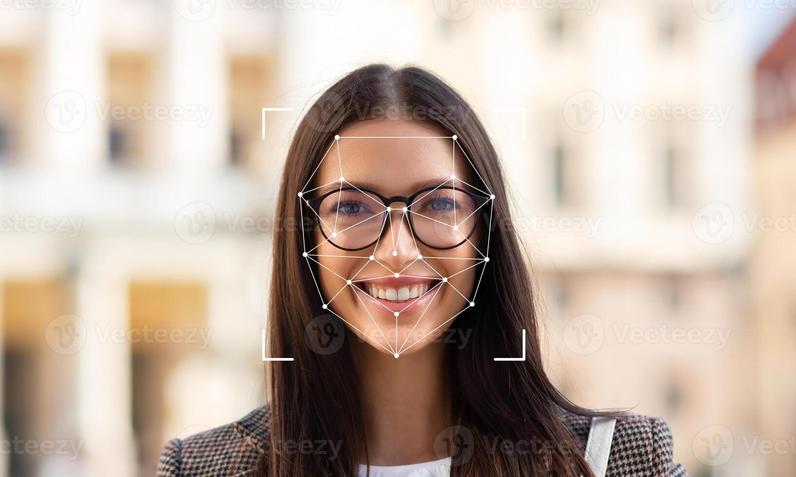 A woman with glasses smiles at the camera while facial identification technology highlights her features. The background shows a blurred urban setting filled with soft colors. photo