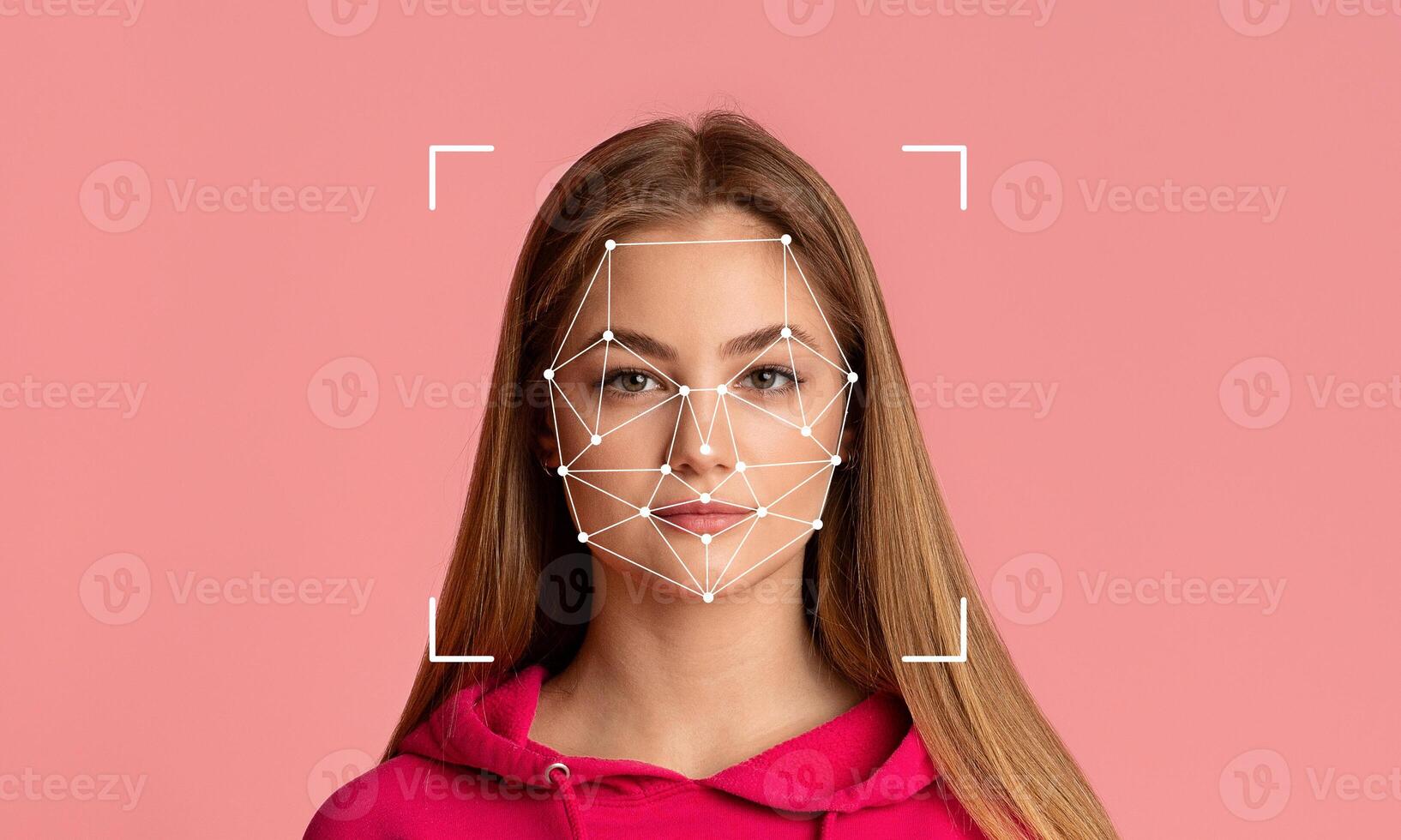 A young woman is featured with facial recognition technology overlaying her face. photo