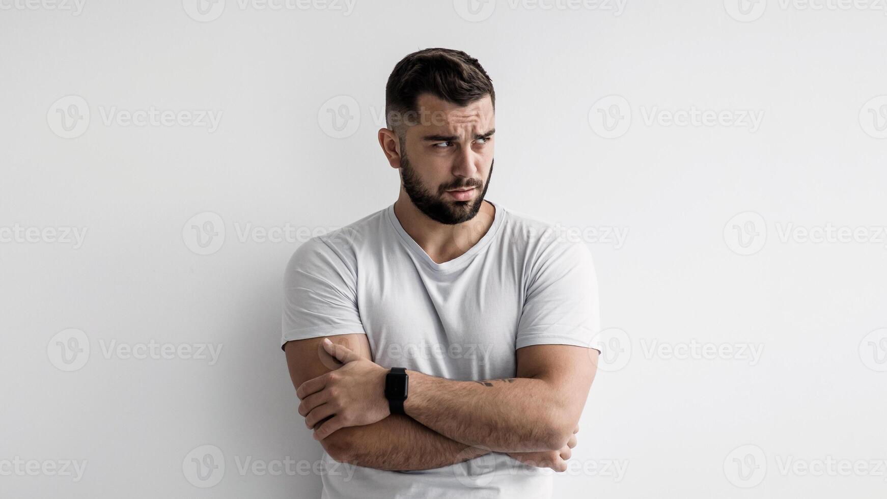 Offended, upset, depression emotions of people. Guilty sad unhappy pensive millennial caucasian handsome guy with crossed arms, suffering from problems on white wall background, panorama, empty space photo