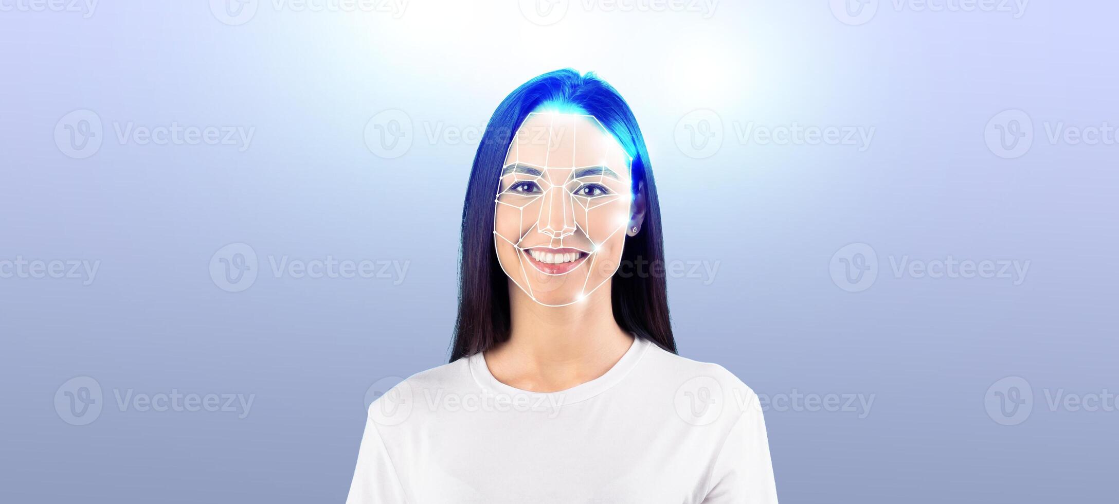 A young woman with a bright smile demonstrates advanced facial recognition technology. This scene is set against a soft, isolated background, highlighting the technology's capabilities. photo