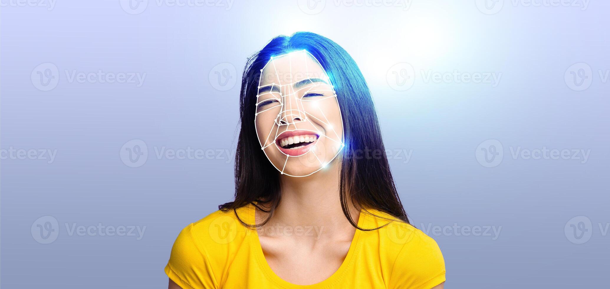 A young woman with a bright smile experiences facial recognition technology. She is isolated against a simple background, showcasing the advancements in modern identification methods. photo