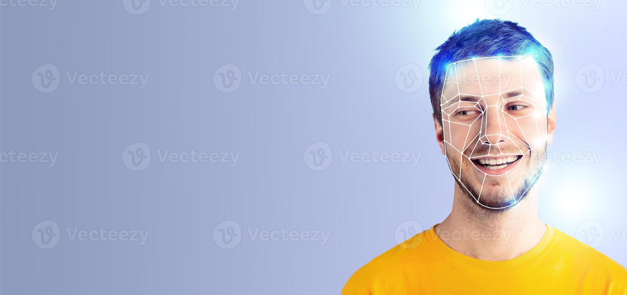 A young man smiles as advanced facial recognition technology analyzes his features. The isolated background highlights the modern application of identification techniques in everyday life. photo