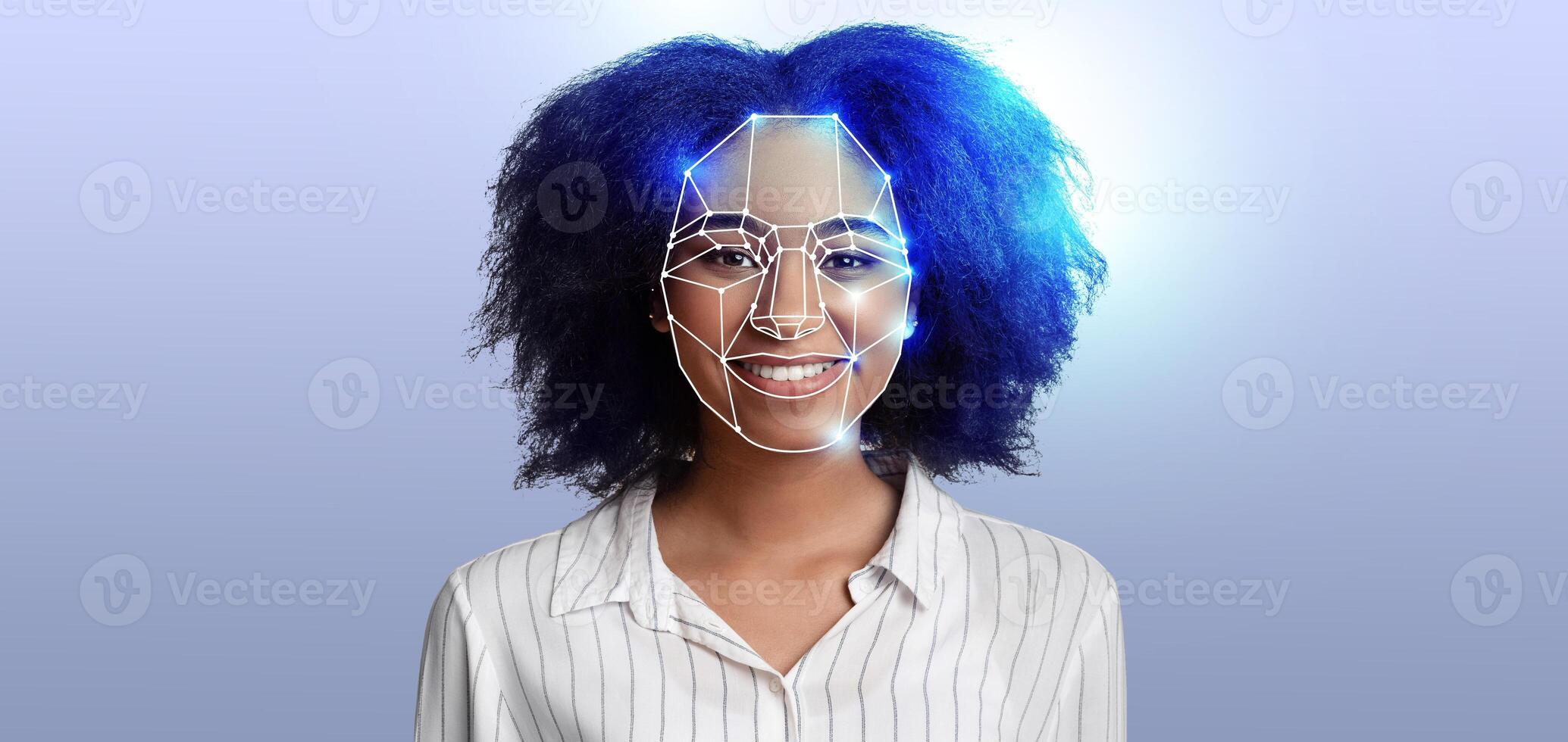 A woman with curly hair smiles as facial recognition technology scans her features. This representation highlights advancements in identification systems, emphasizing innovation in modern technology. photo
