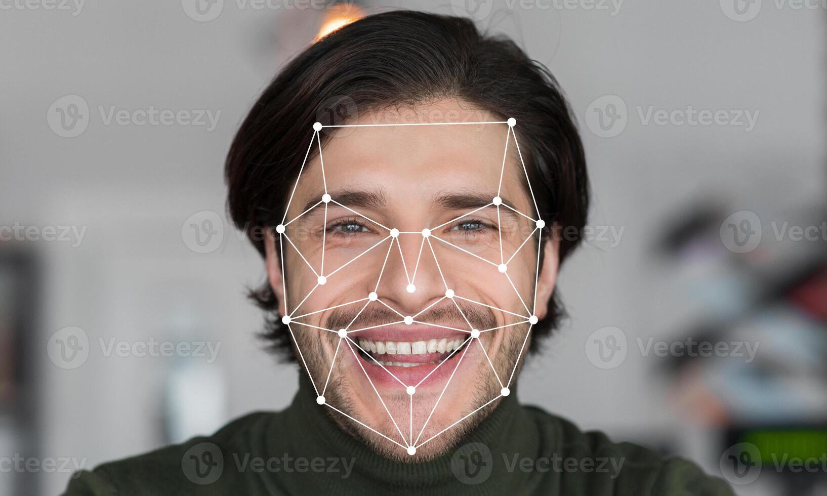 A joyful man smiles while facial recognition technology analyzes his facial features. photo