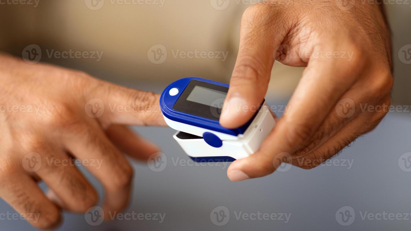 Male hands using modern pulse oximeter, closeup photo, copy space. Unrecognizable middle-eastern man putting clip-like small device for blood oxygen, saturation measuring, cropped photo