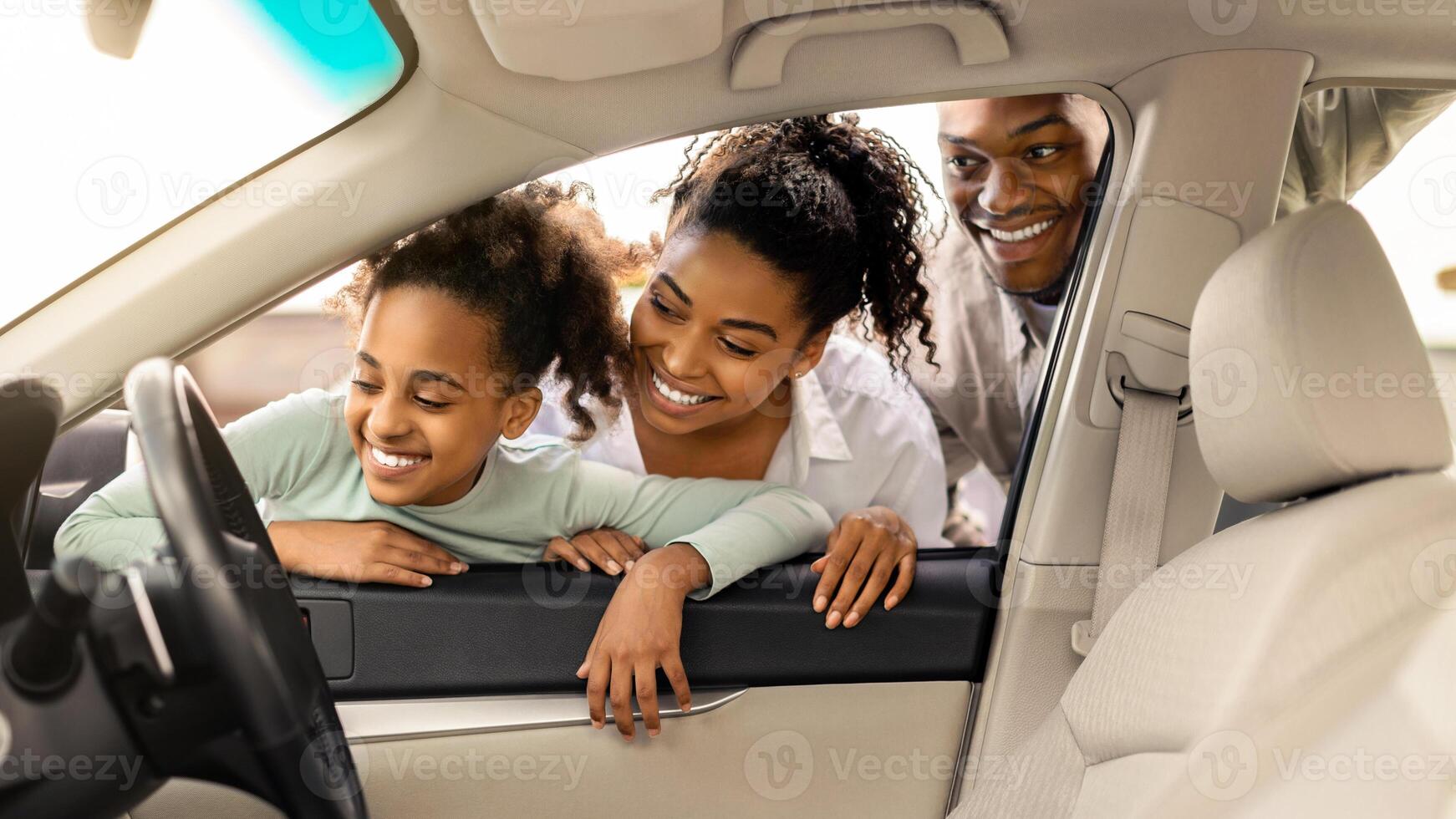 Cheerful Black Family Of Three Buying New Car, Looking Through Window At Auto Interior Choosing Luxury Automobile In Dealership. Vehicle Rent And Purchase Concept photo