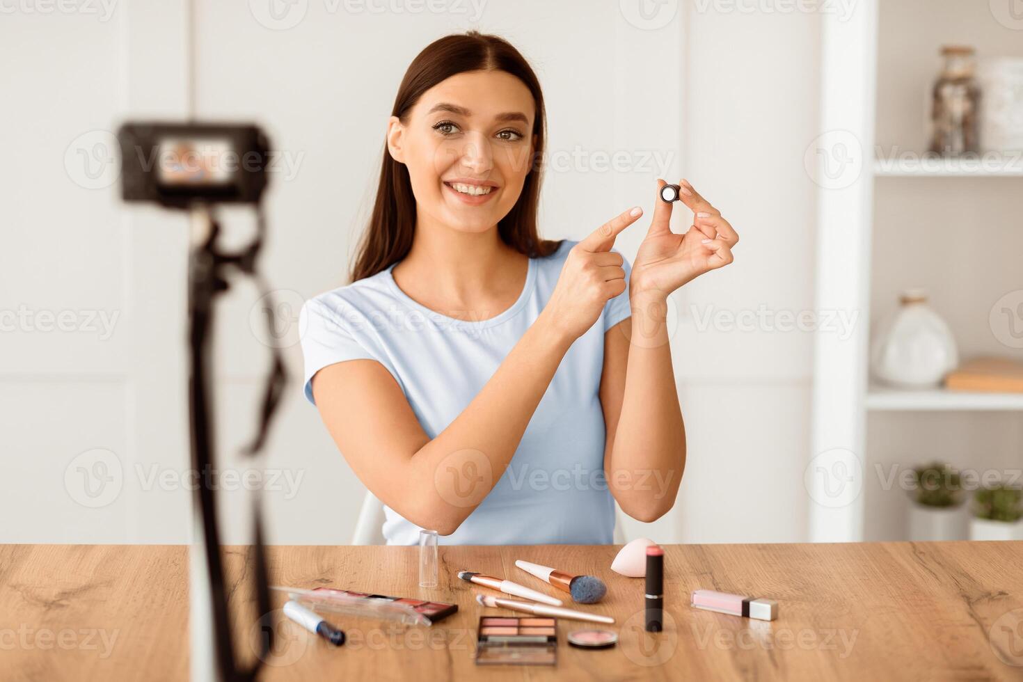Makeup Blogger. Woman Making Tutorial About Cosmetics And Make-Up At Home. Selective Focus photo