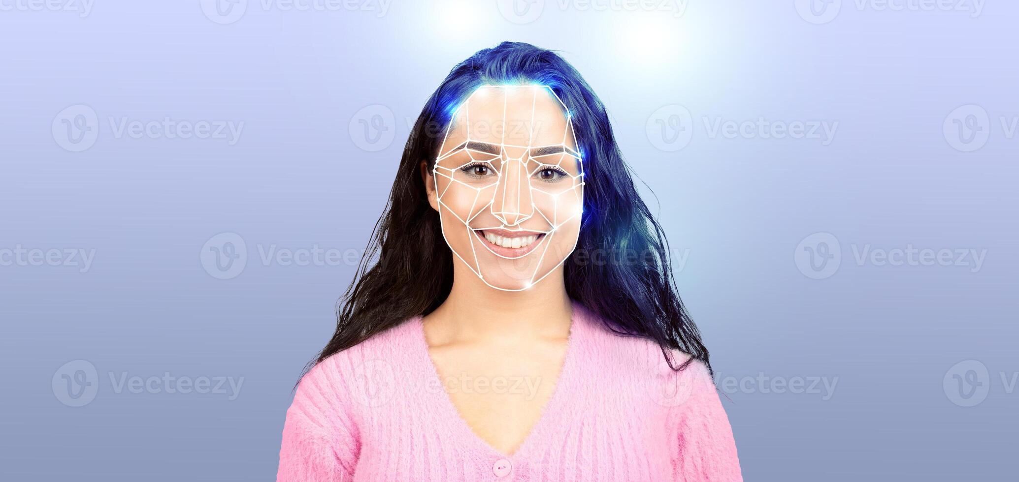 A woman smiles confidently while undergoing facial recognition technology. Her face is illuminated, highlighting the details and showcasing modern identification methods in a contemporary setting. photo