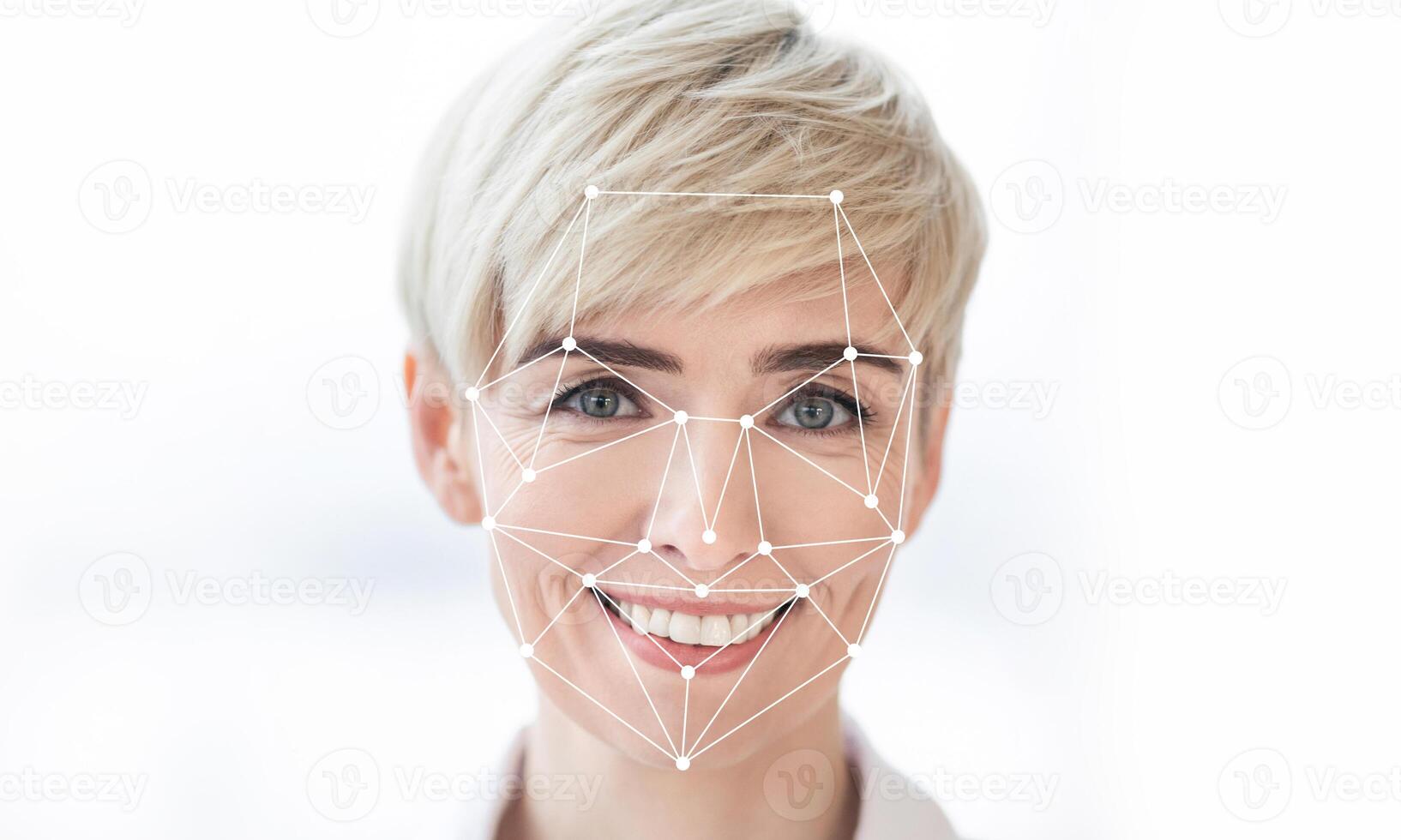 This image illustrates the application of facial recognition technology on a woman's joyful expression. The visual features facial mapping points indicating identification processes in modern tech. photo