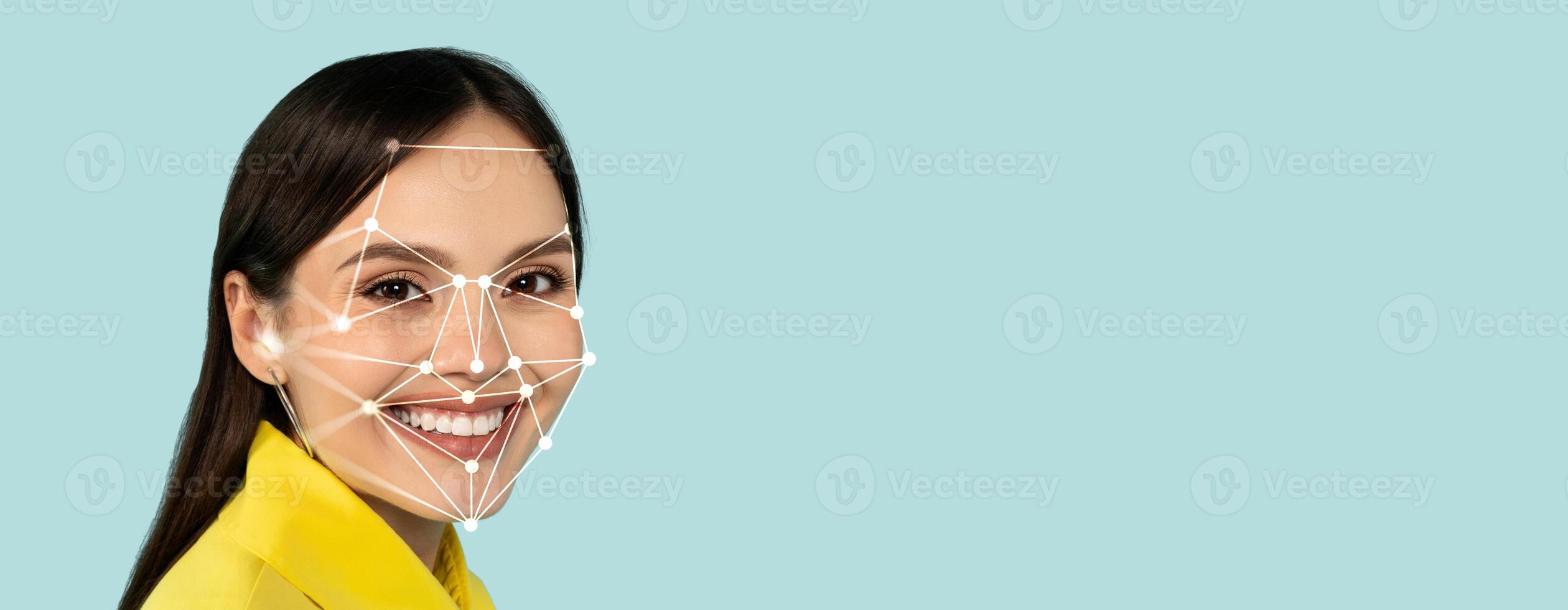 A smiling individual is shown with facial recognition technology applied to their face. The design demonstrates the identification process in a clean, isolated setting, emphasizing modern technology. photo