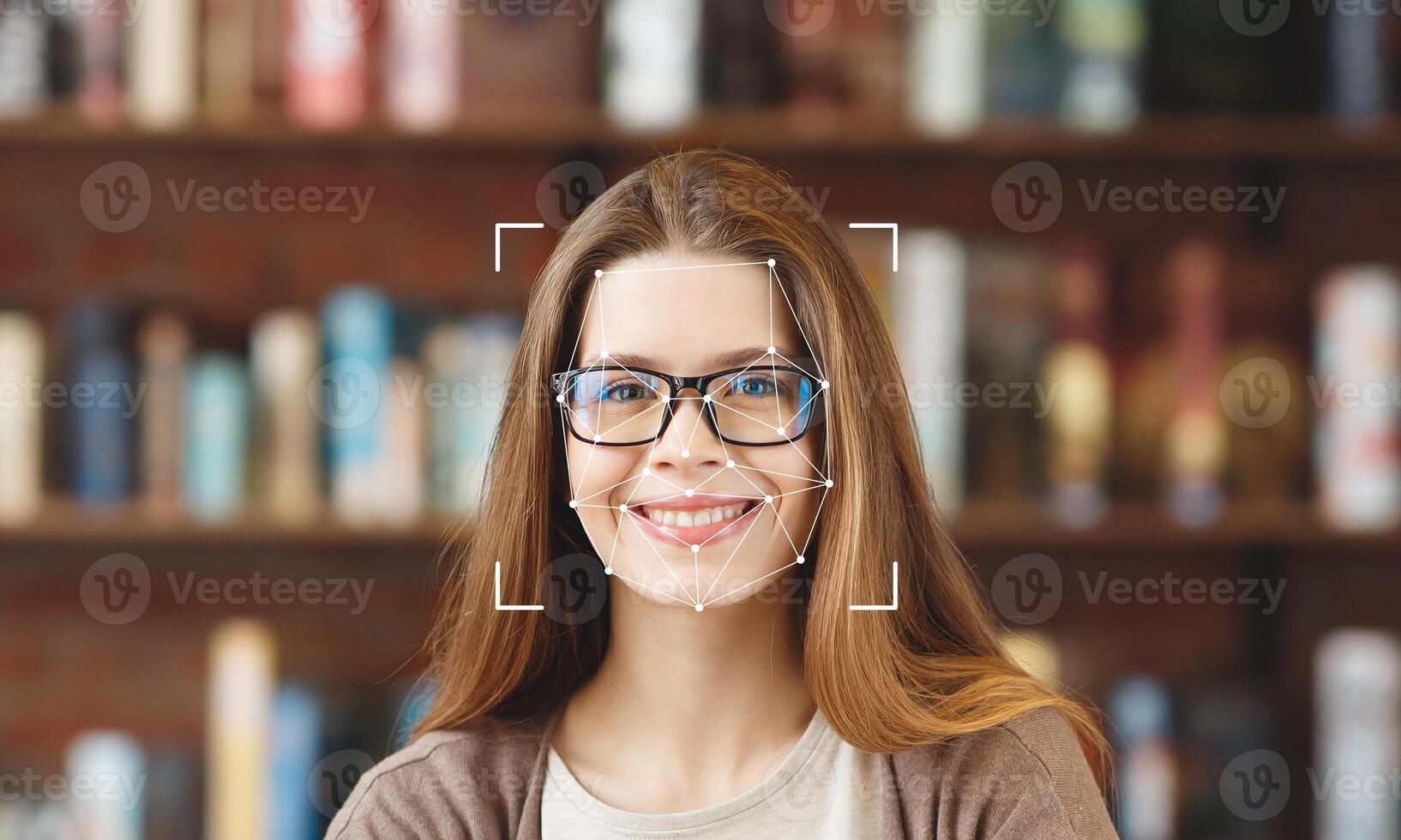 A woman with glasses smiles while her face is being analyzed by facial recognition technology. In the background, bookshelves are filled with a variety of books. photo